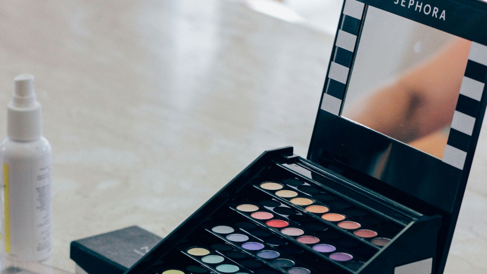 A table with makeup and cosmetics on it