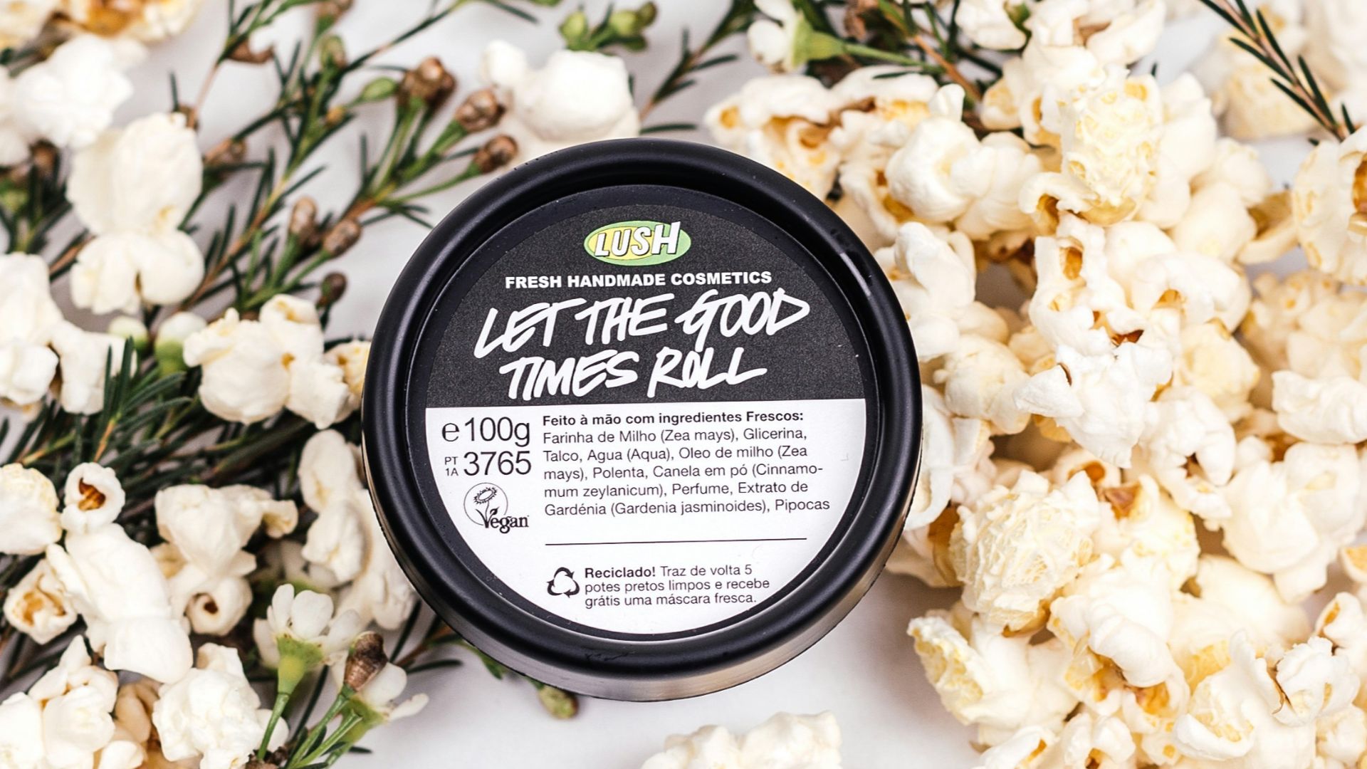 white flowers on black round container