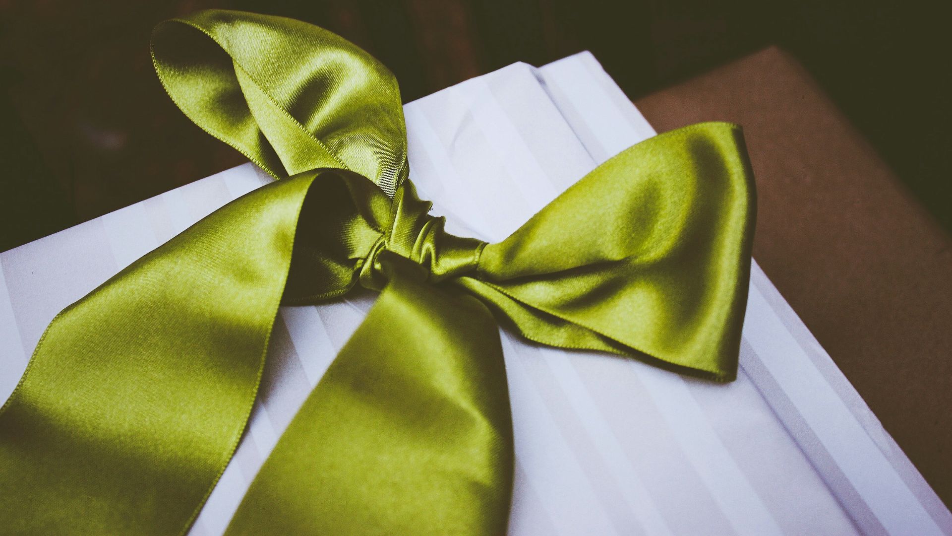 green bow tie on table