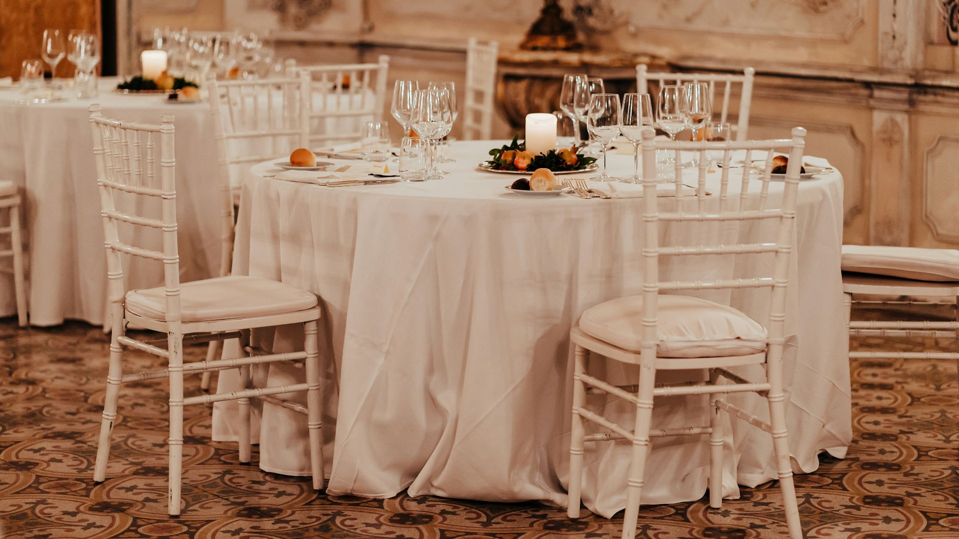 grayscale photo of dining table with chairs