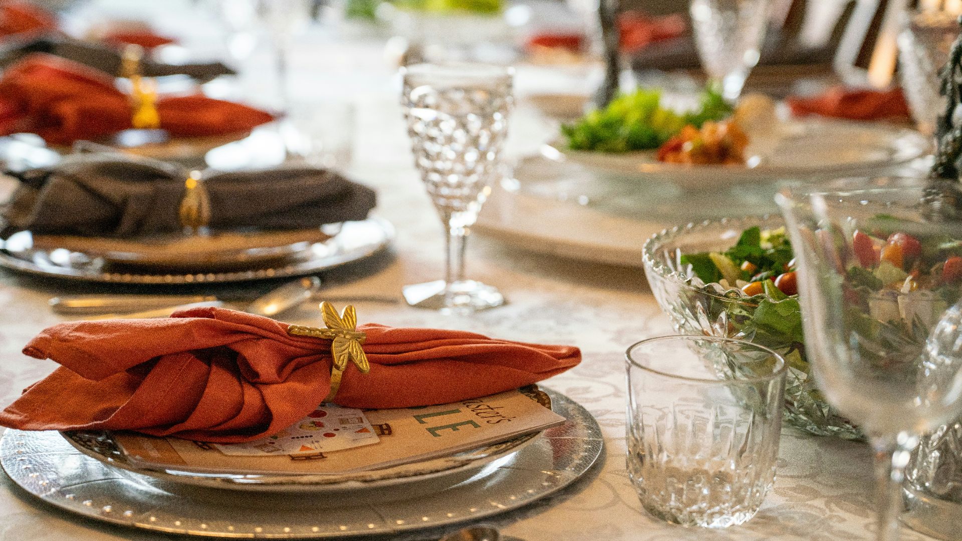 a table set with place settings and napkins