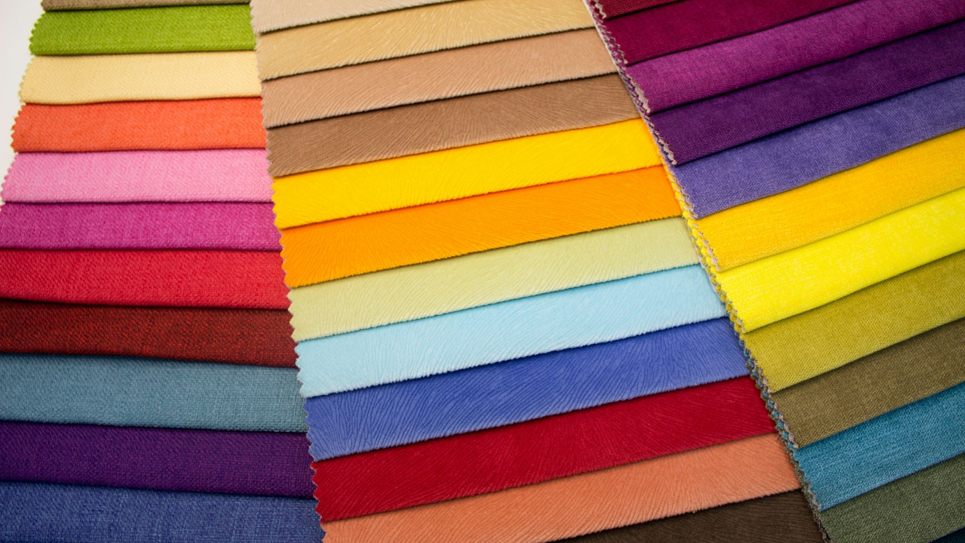 multi colored striped textile on brown wooden table