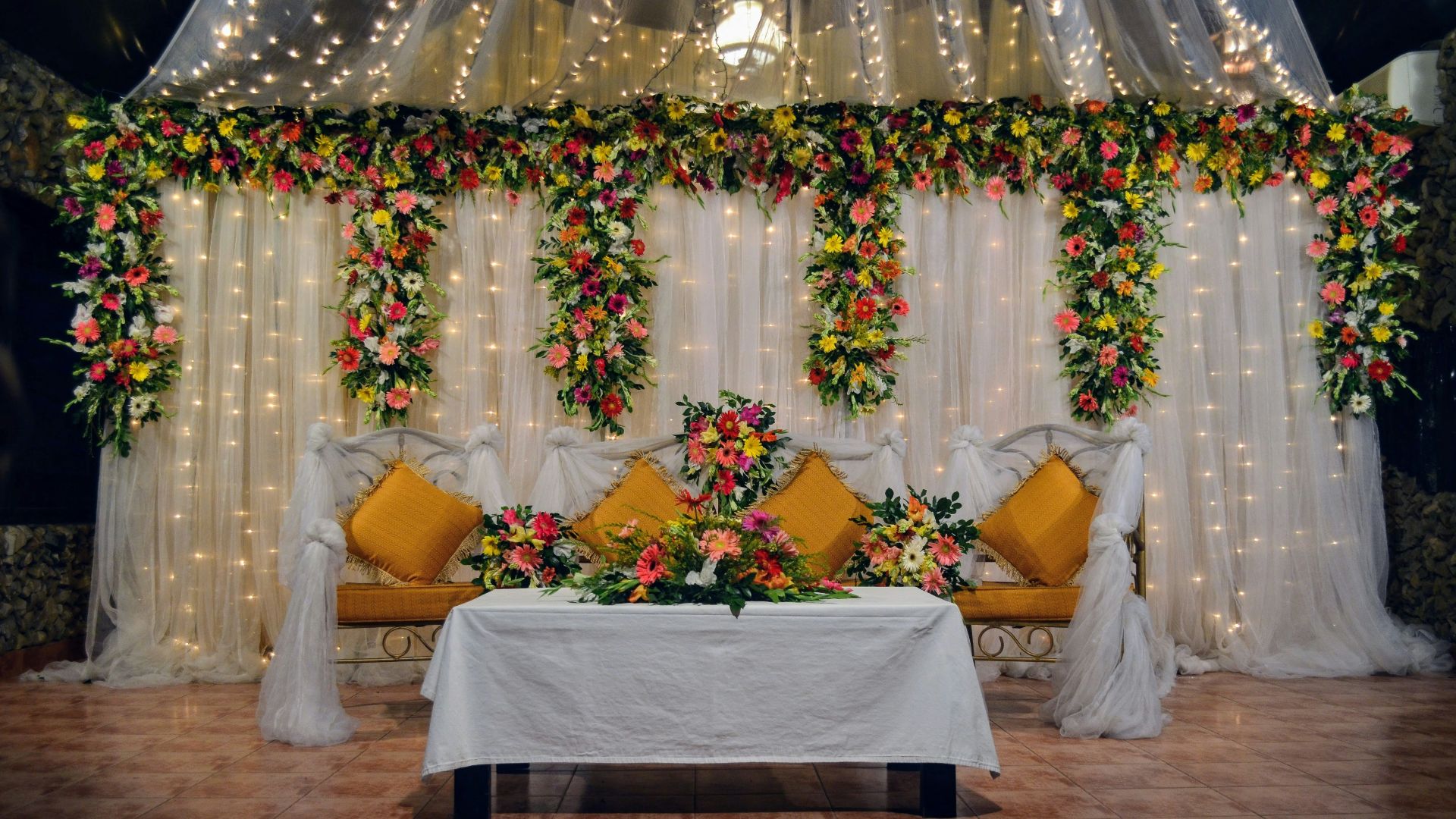 yellow and white throw pillows on white bed