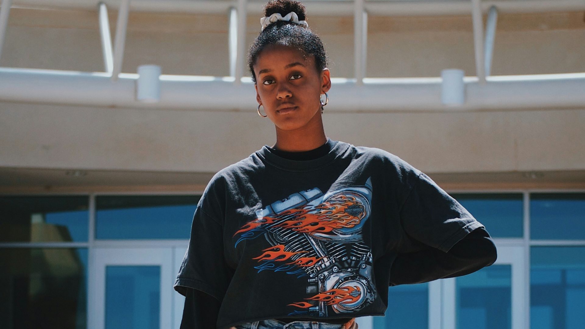 woman standing near building