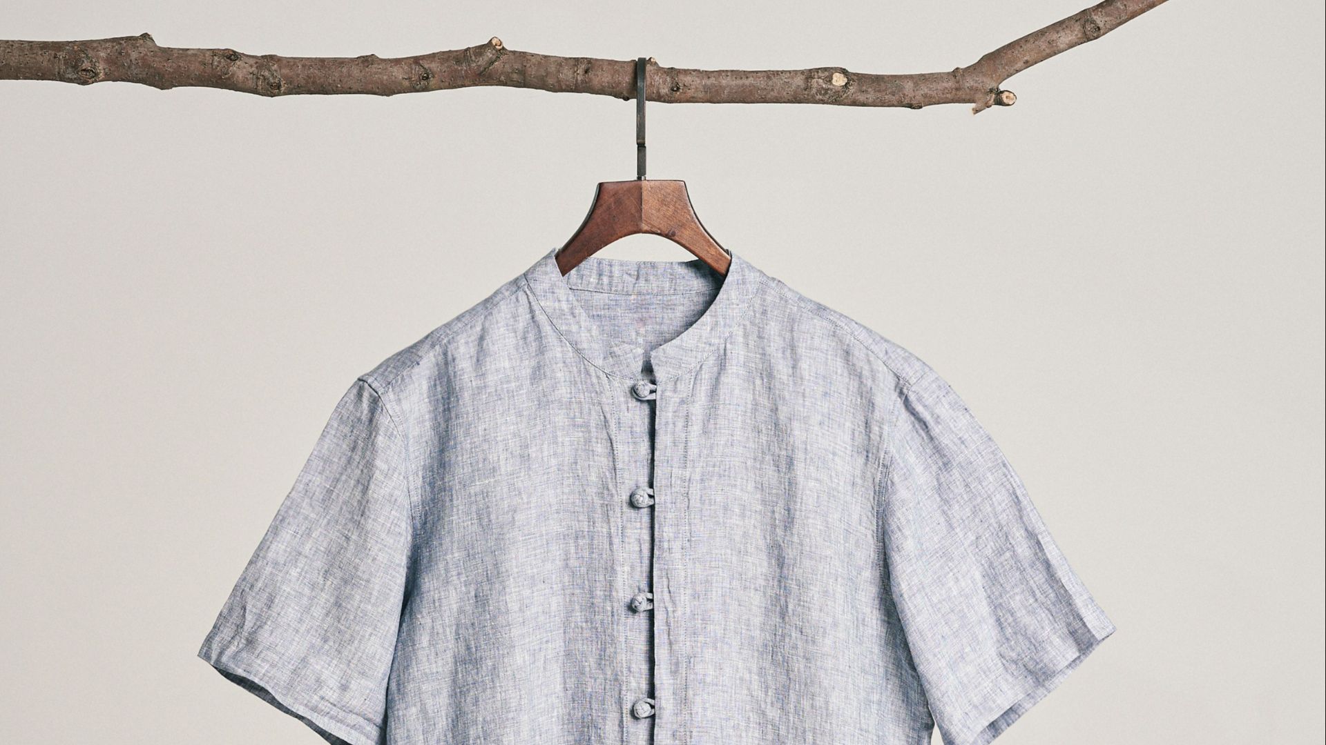 a blue shirt hanging on a clothes line