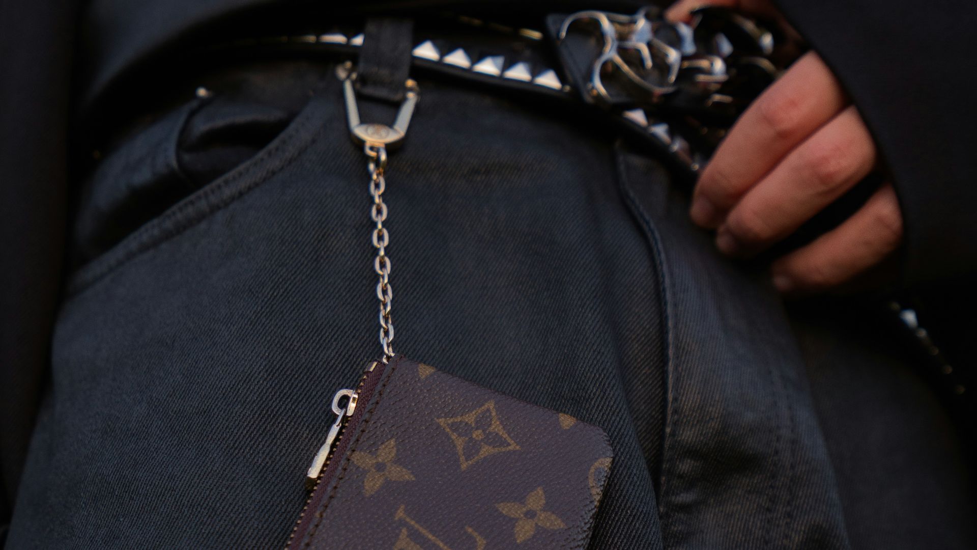 a person with a chain around their waist