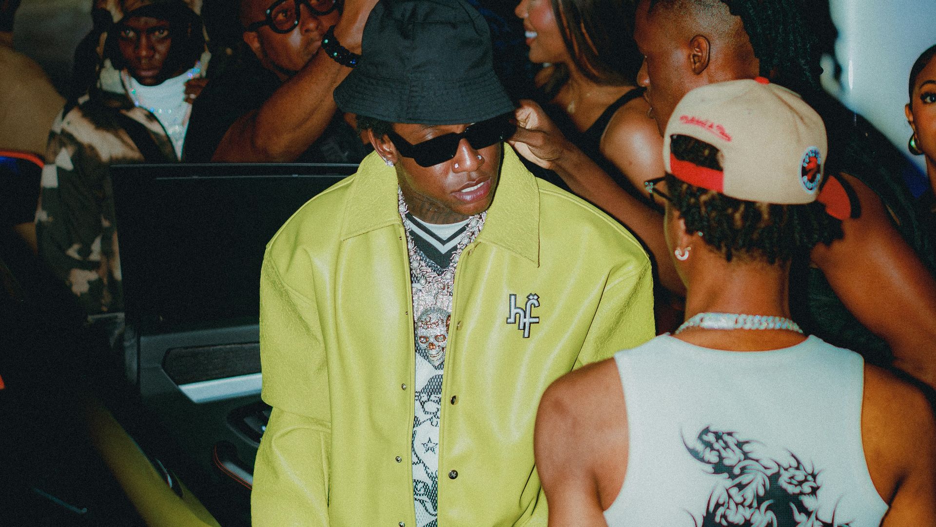 People gathered around a vehicle at night