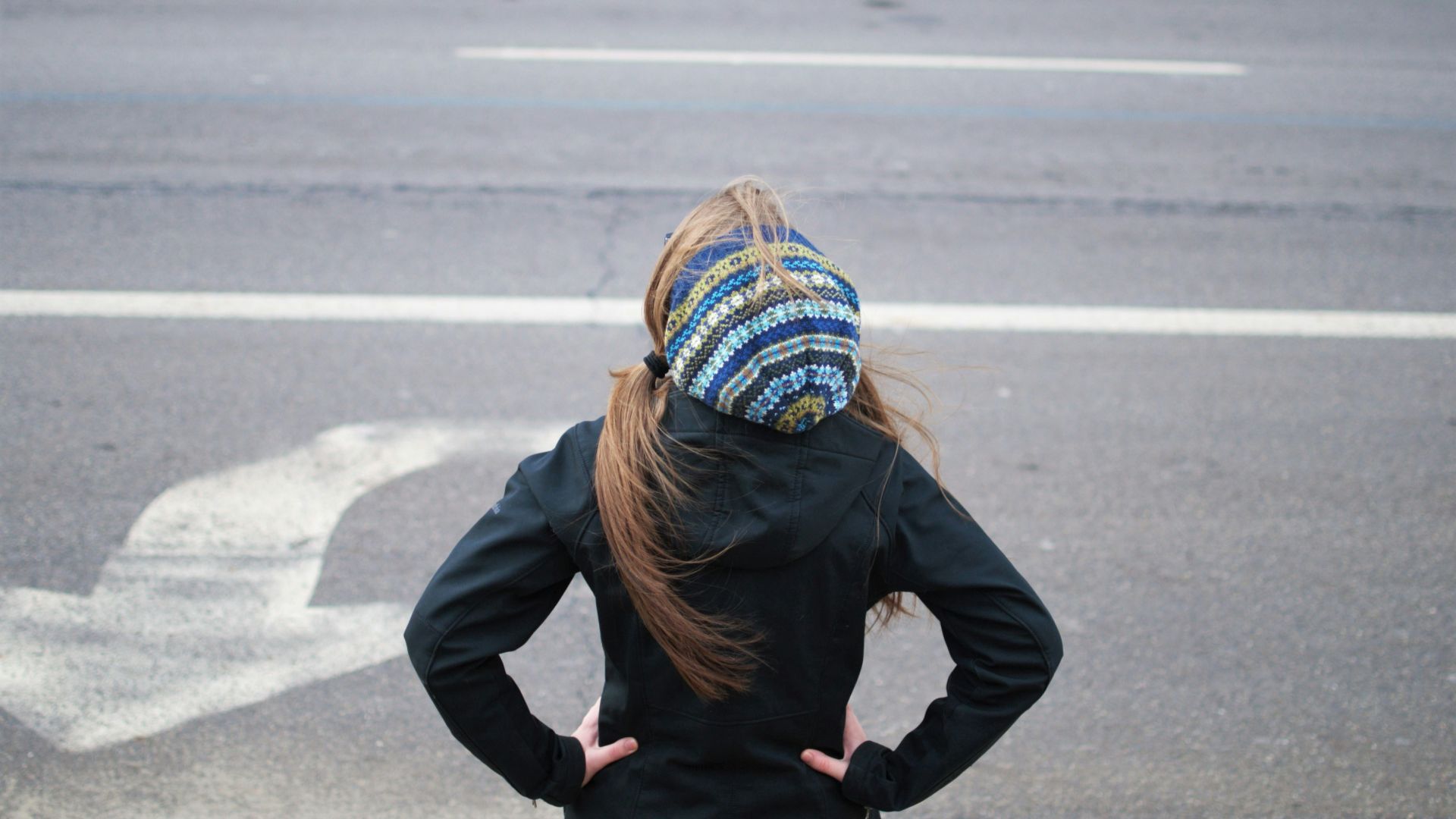 woman standing near road