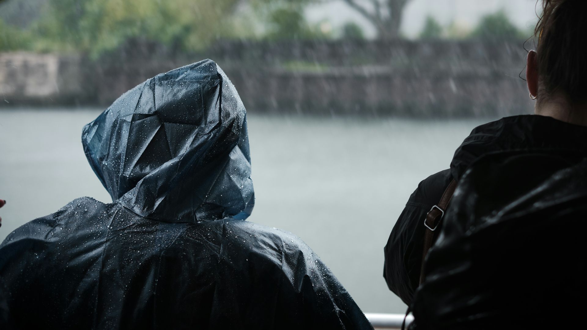 person wearing blue raincoat