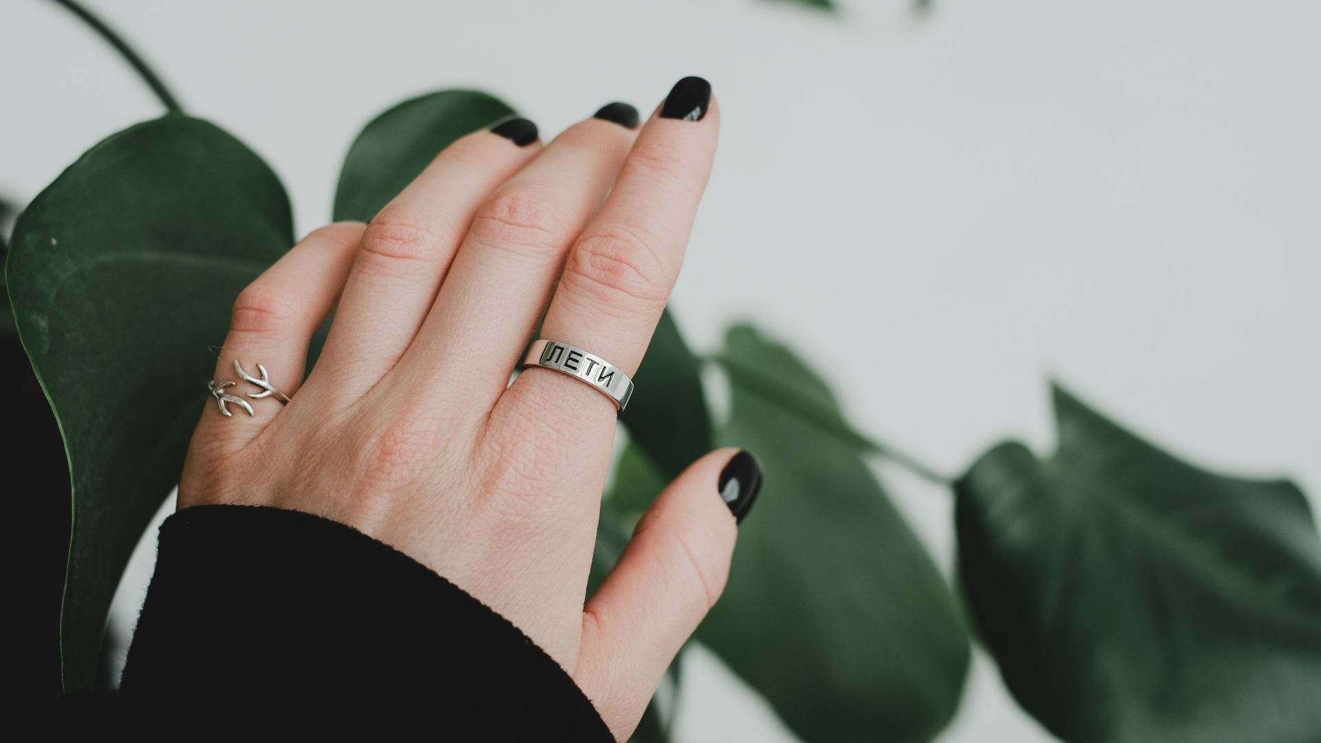 a woman's hand with a ring on it