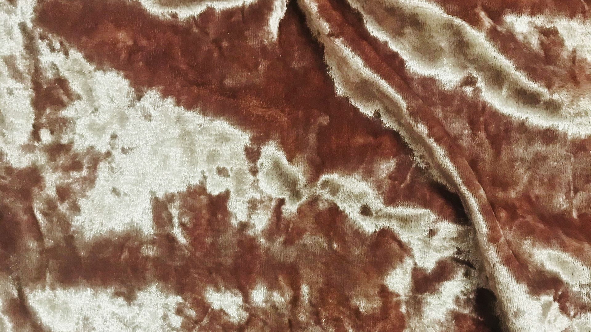 brown and white floral textile