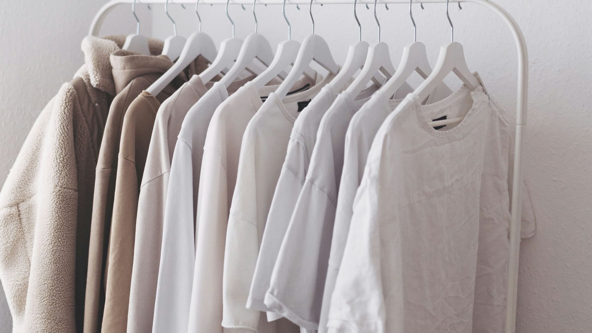 white long sleeve shirt on white clothes hanger