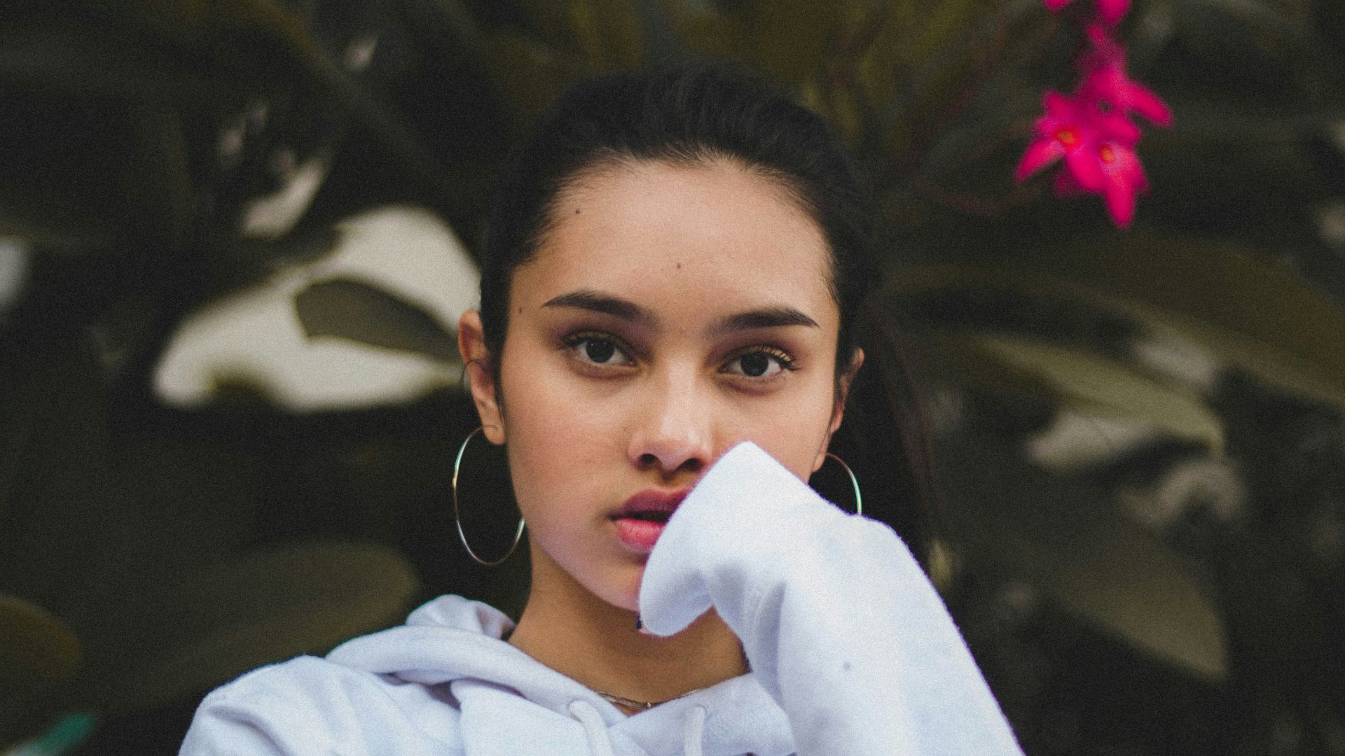 portrait photography of woman in white pullover hoodie