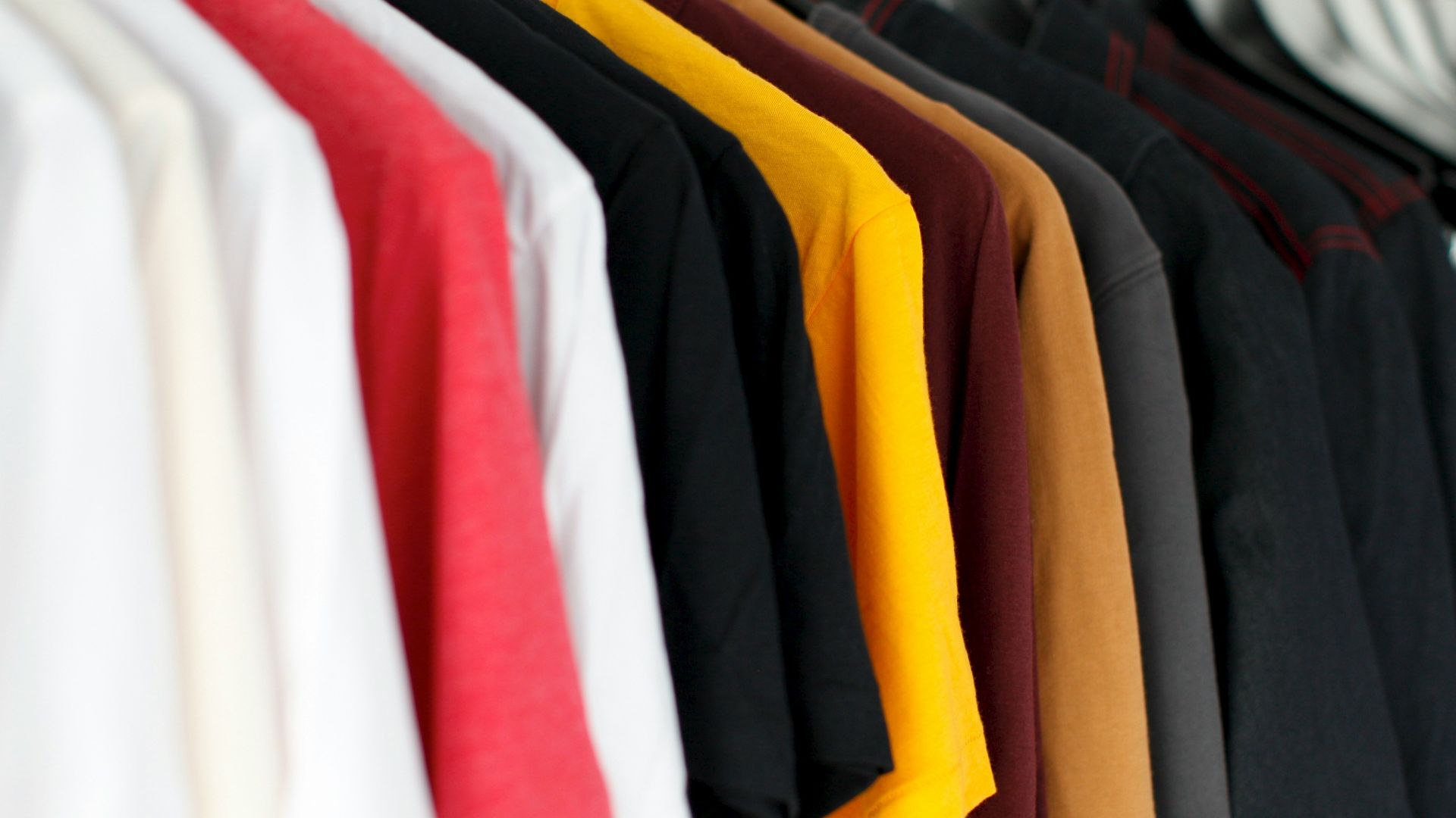 closeup of hanged shirts on rack