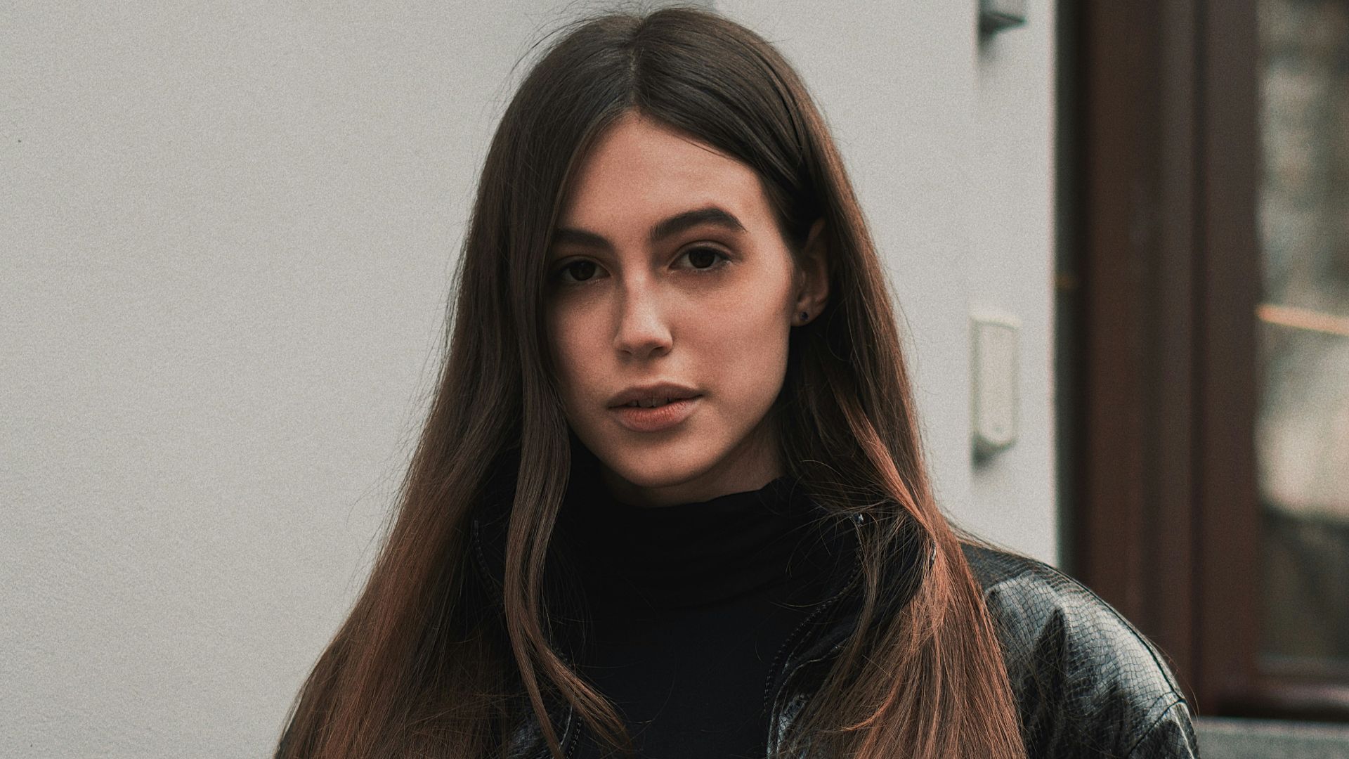 woman wearing black floral coat