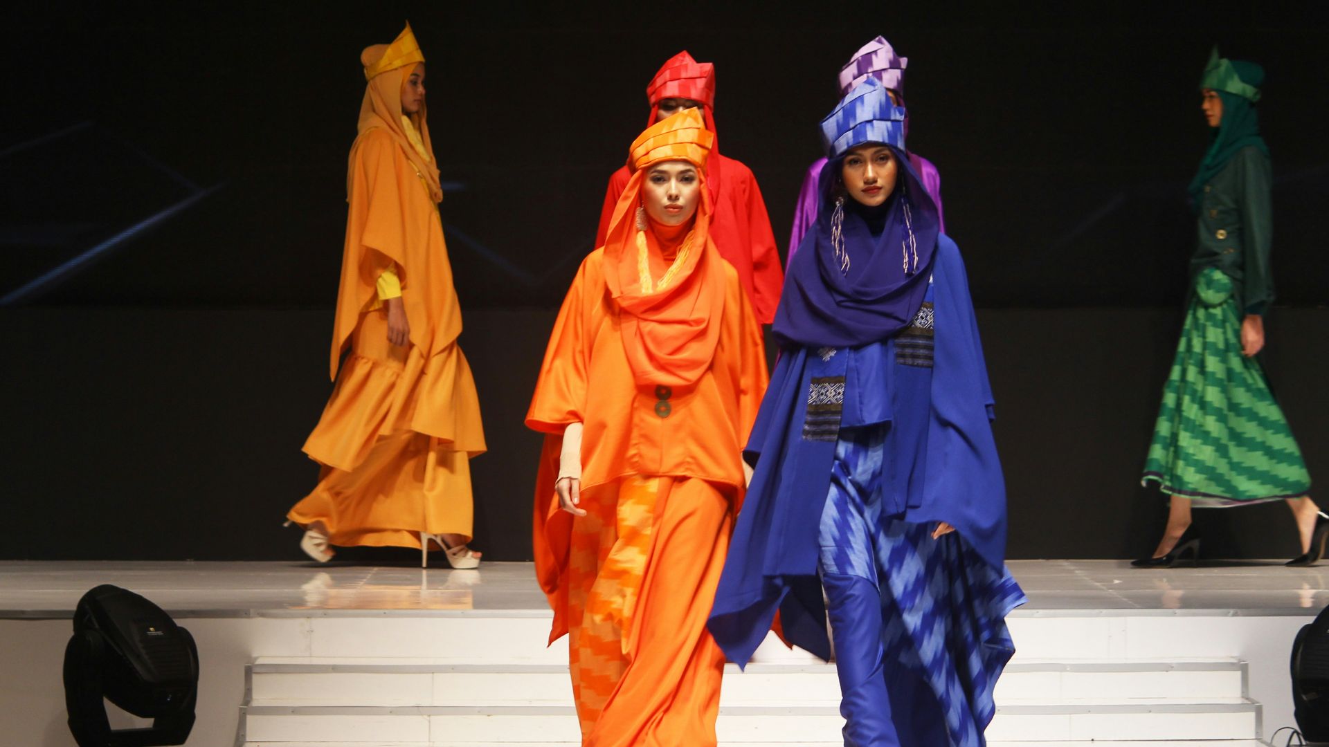 woman wearing dresses walking on catwalk