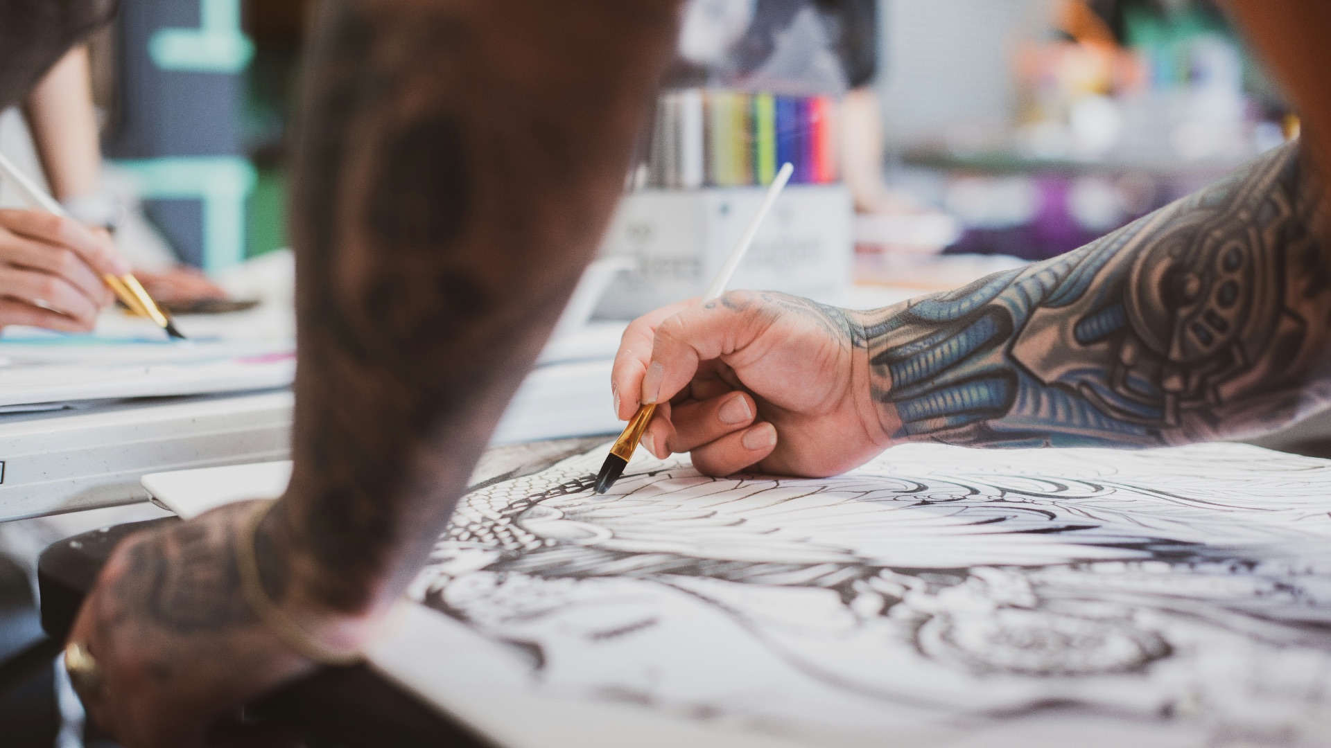 person holding paint brush ]