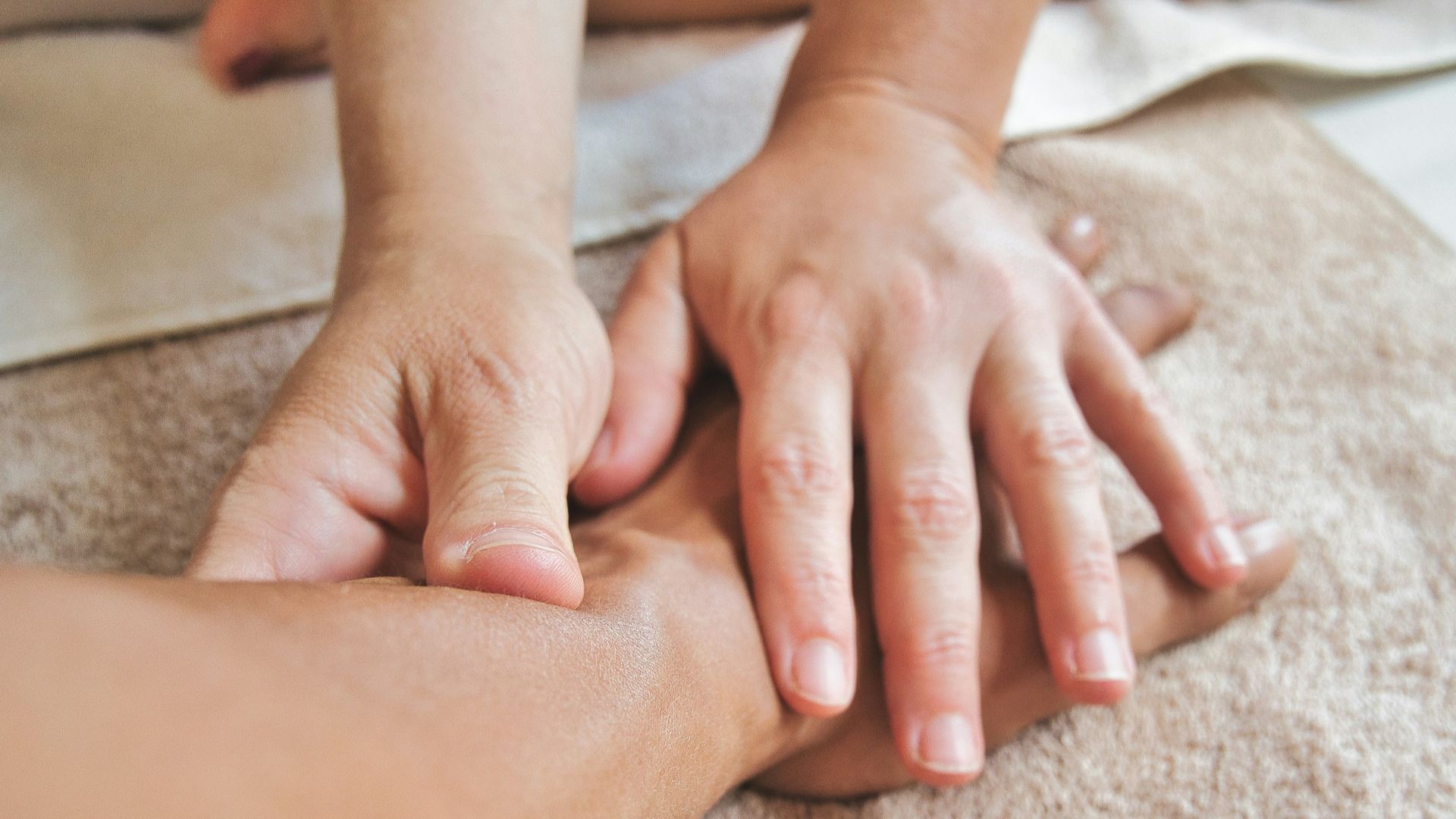 persons hand on persons lap