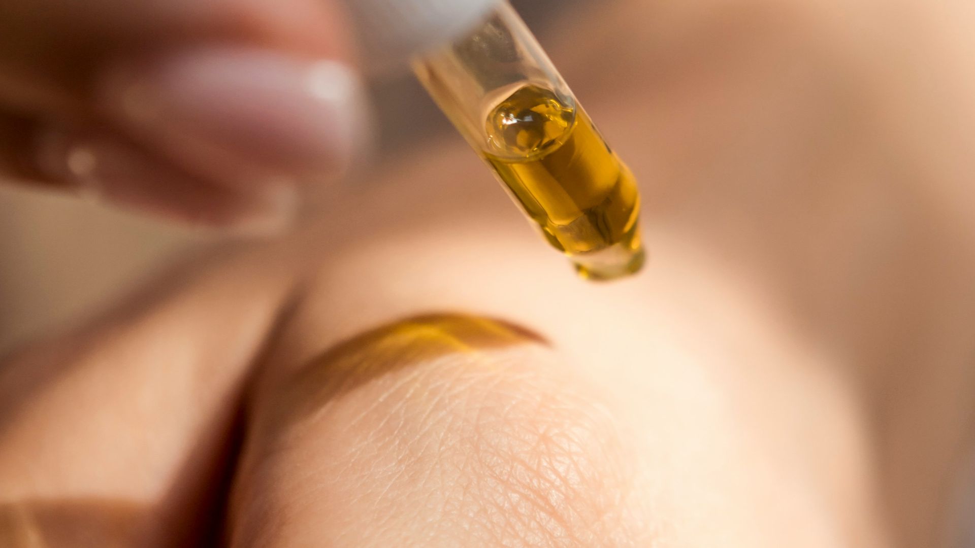 person holding dropper