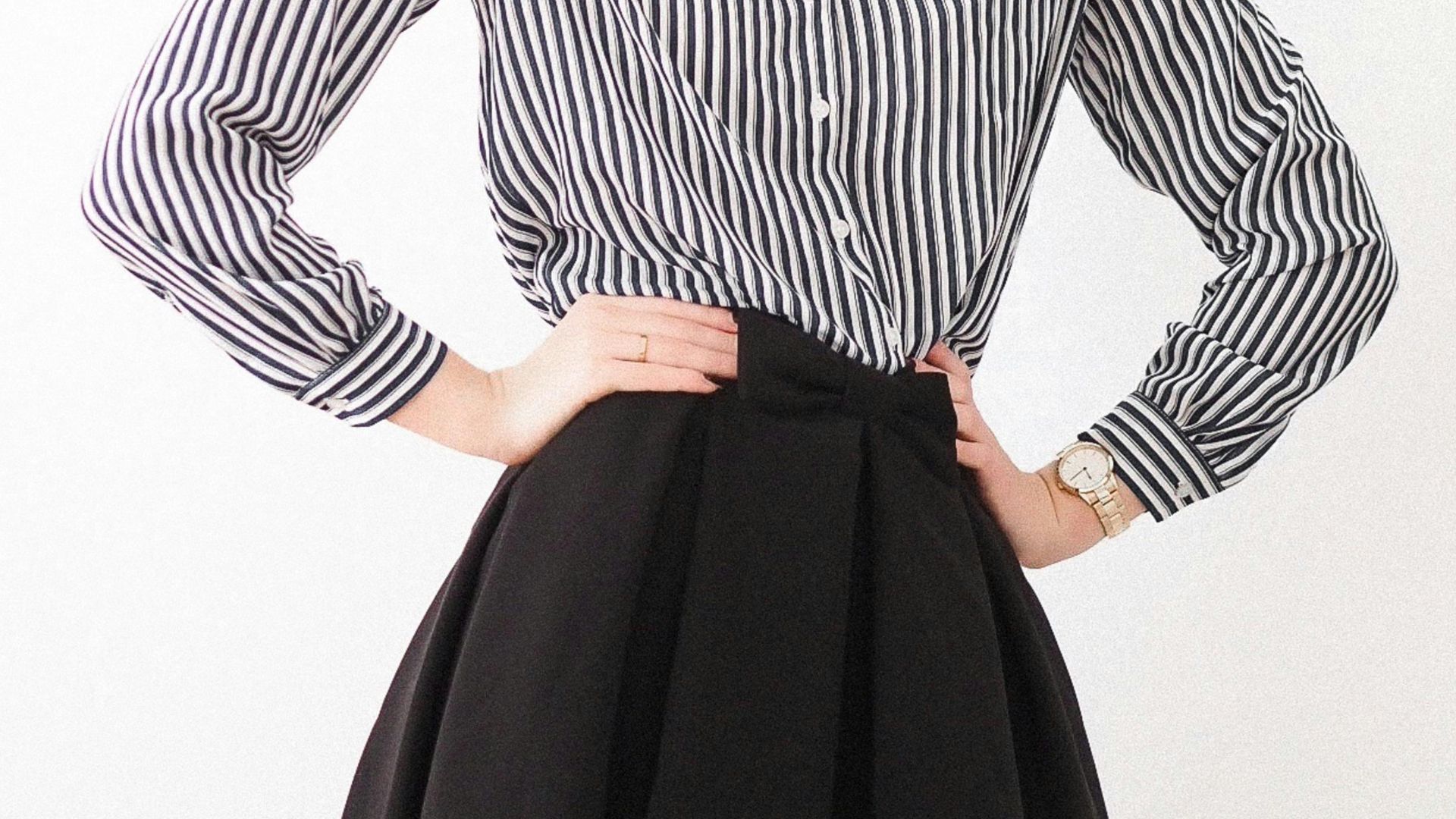 woman in black and white striped long sleeve dress