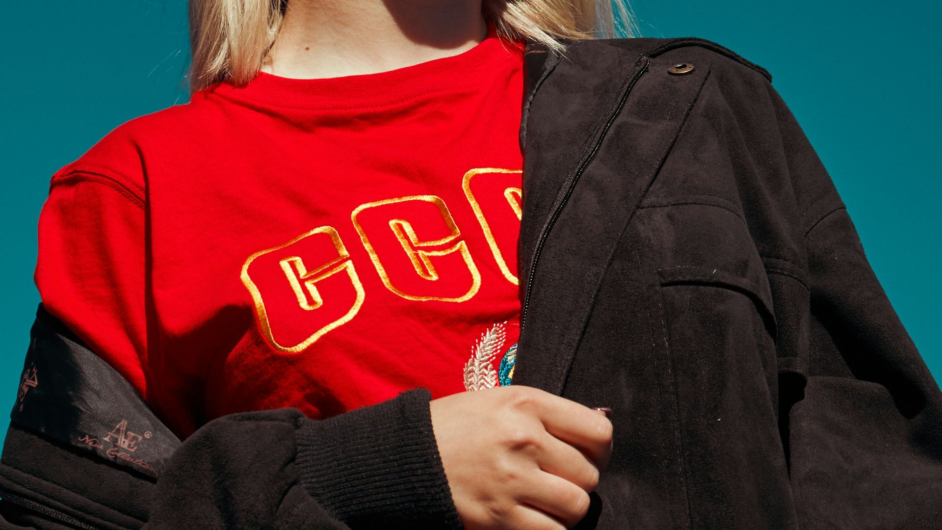 woman with sunglasses standing outdoor during daytime