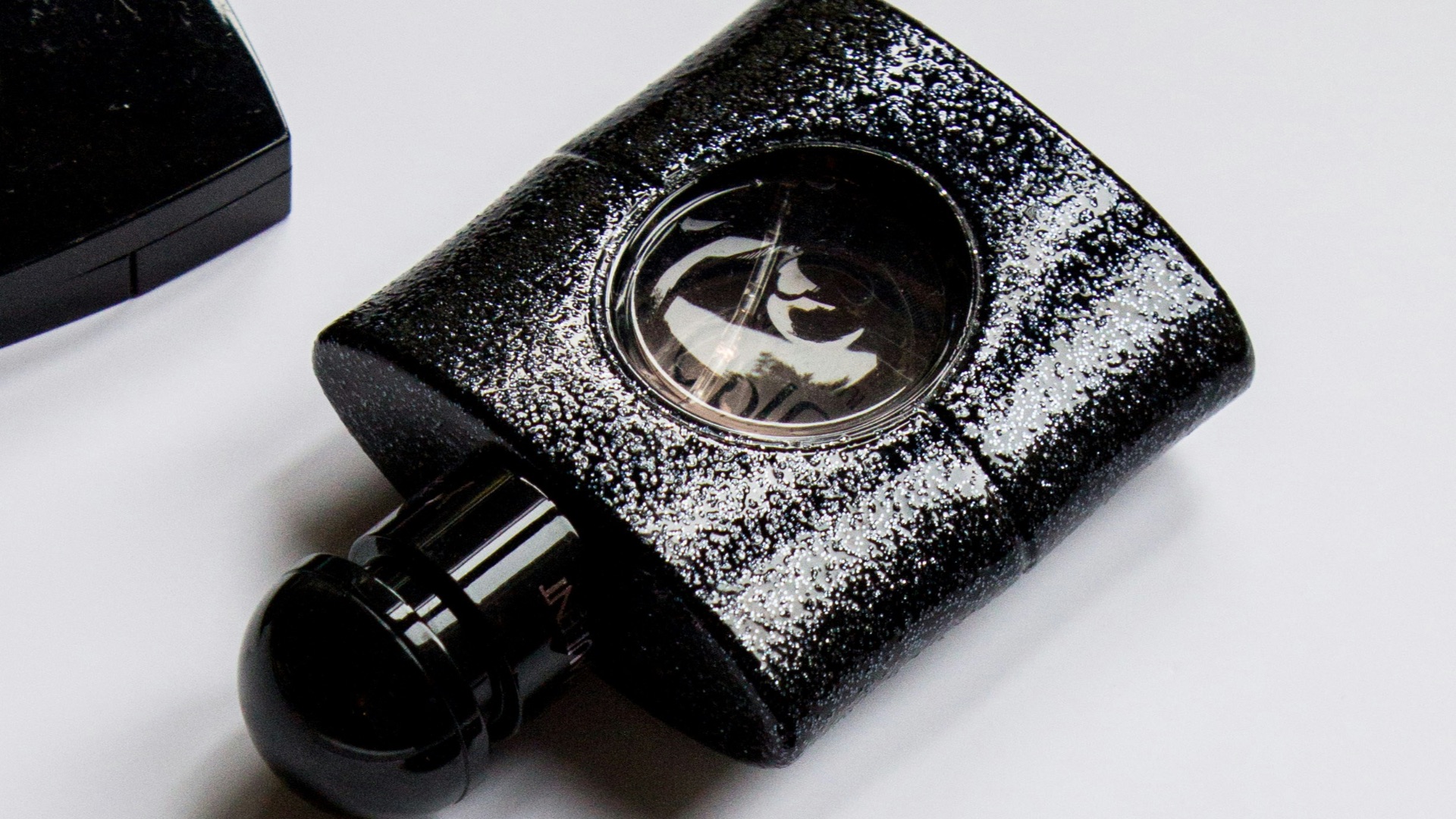 black and silver camera lens beside black and silver vinyl record