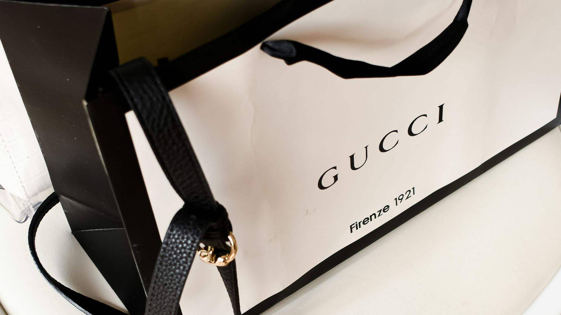 a white bag sitting on top of a white table