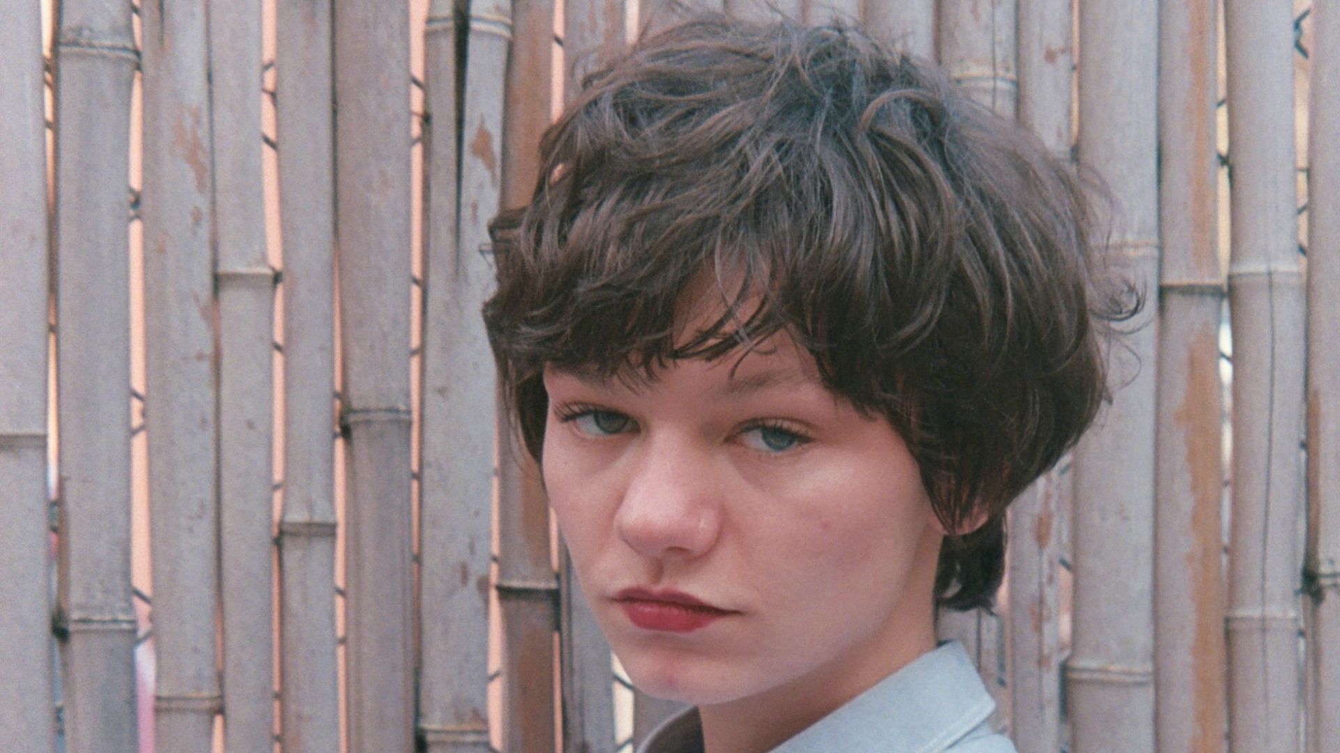 a woman in a dress posing for a picture