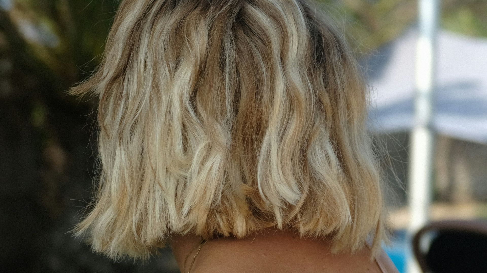 woman in brown spaghetti strap top