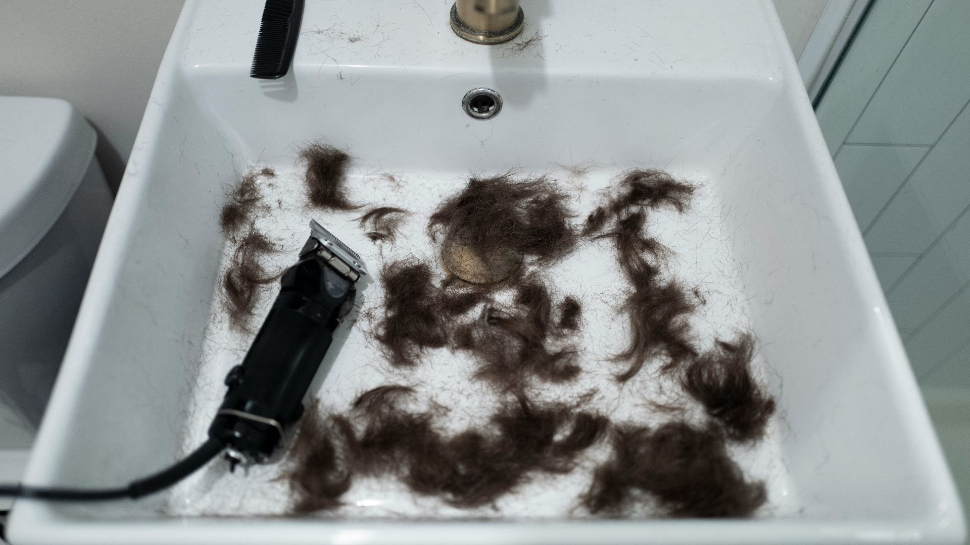 black disposable lighter beside brown and white textile