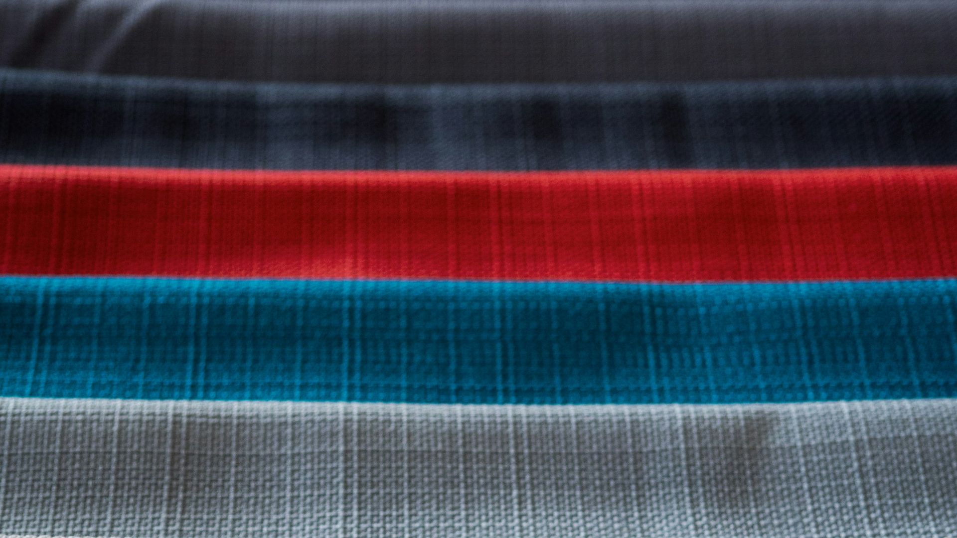 red white and black striped textile