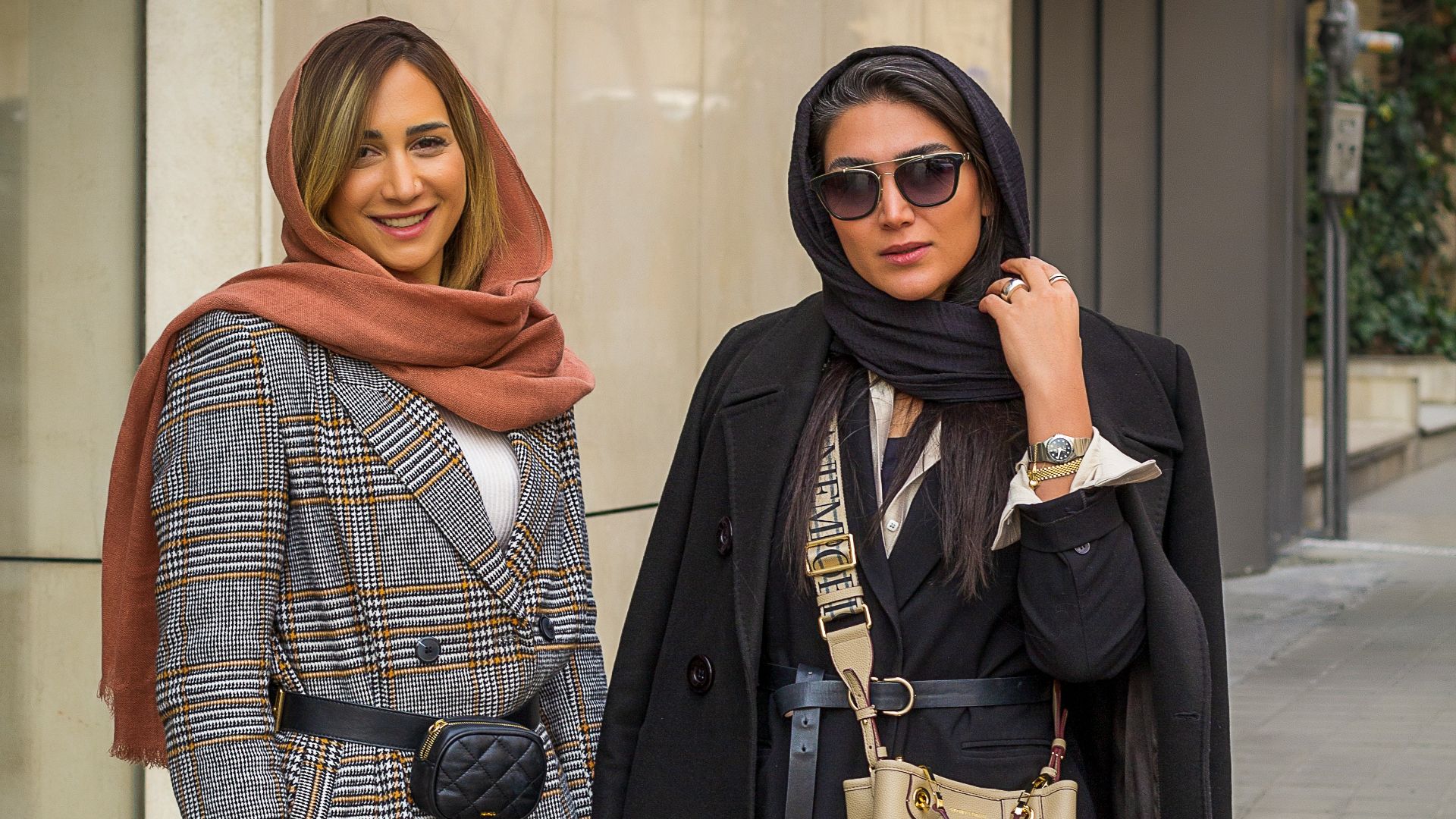 a couple of women standing next to each other