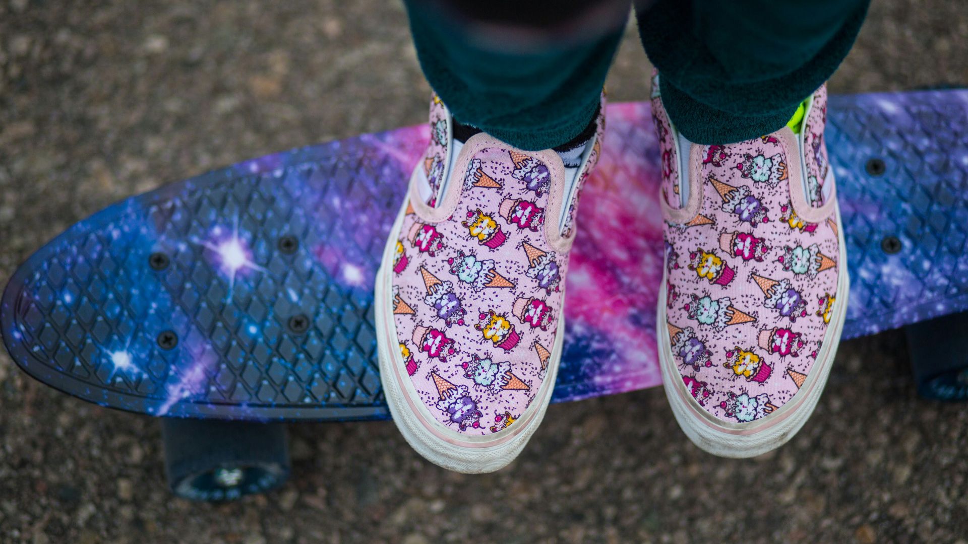 person wearing pink and white floral shoes