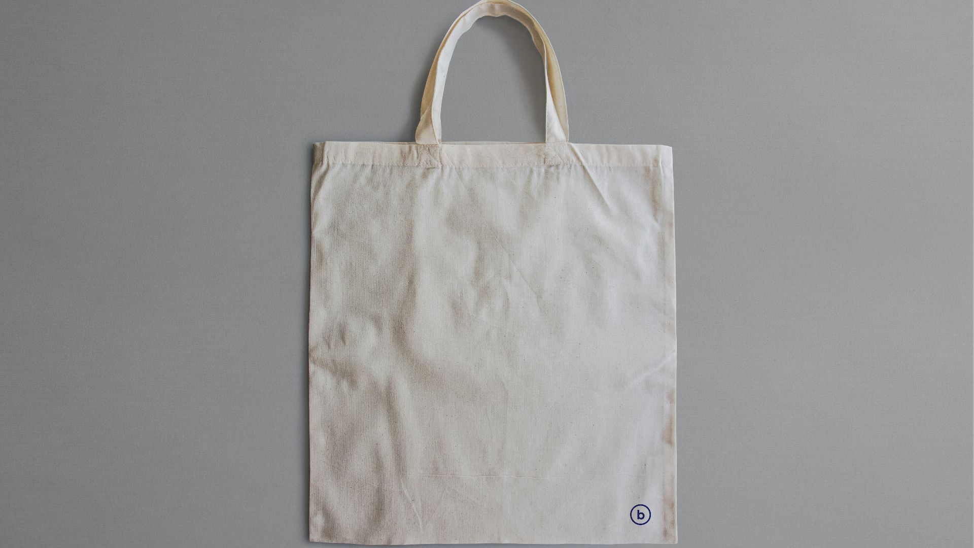 white reusable bag on gray surface