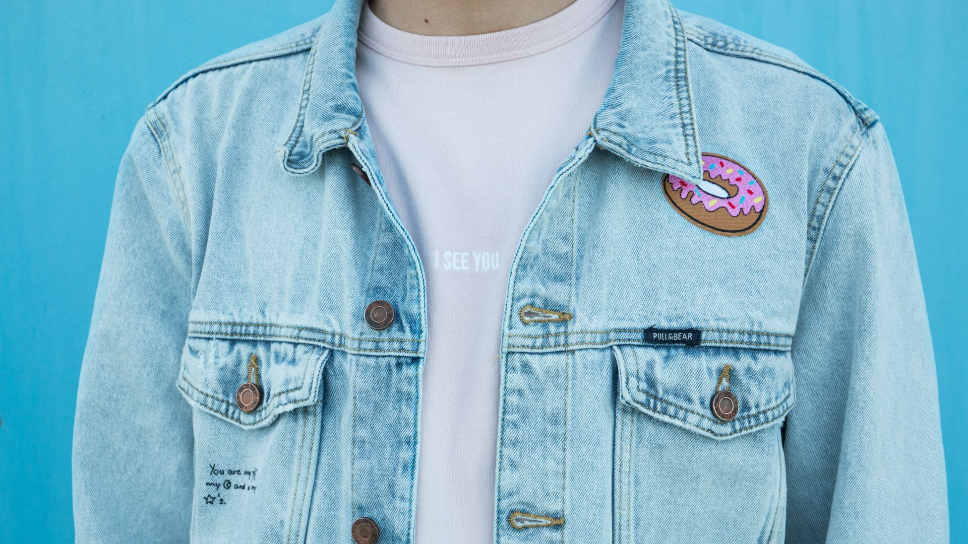 close shot of person denim top