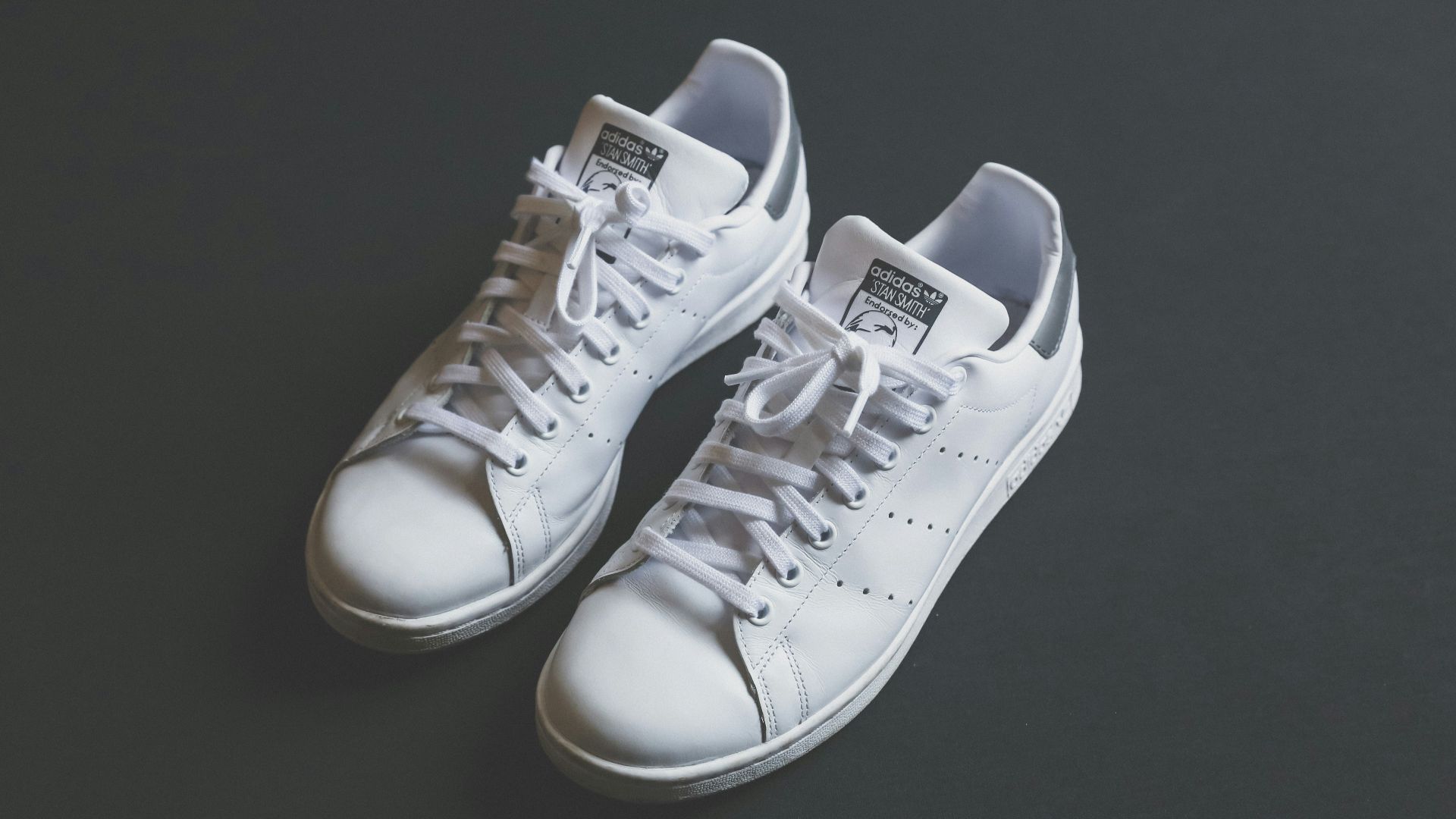 pair of white low-top sneakers