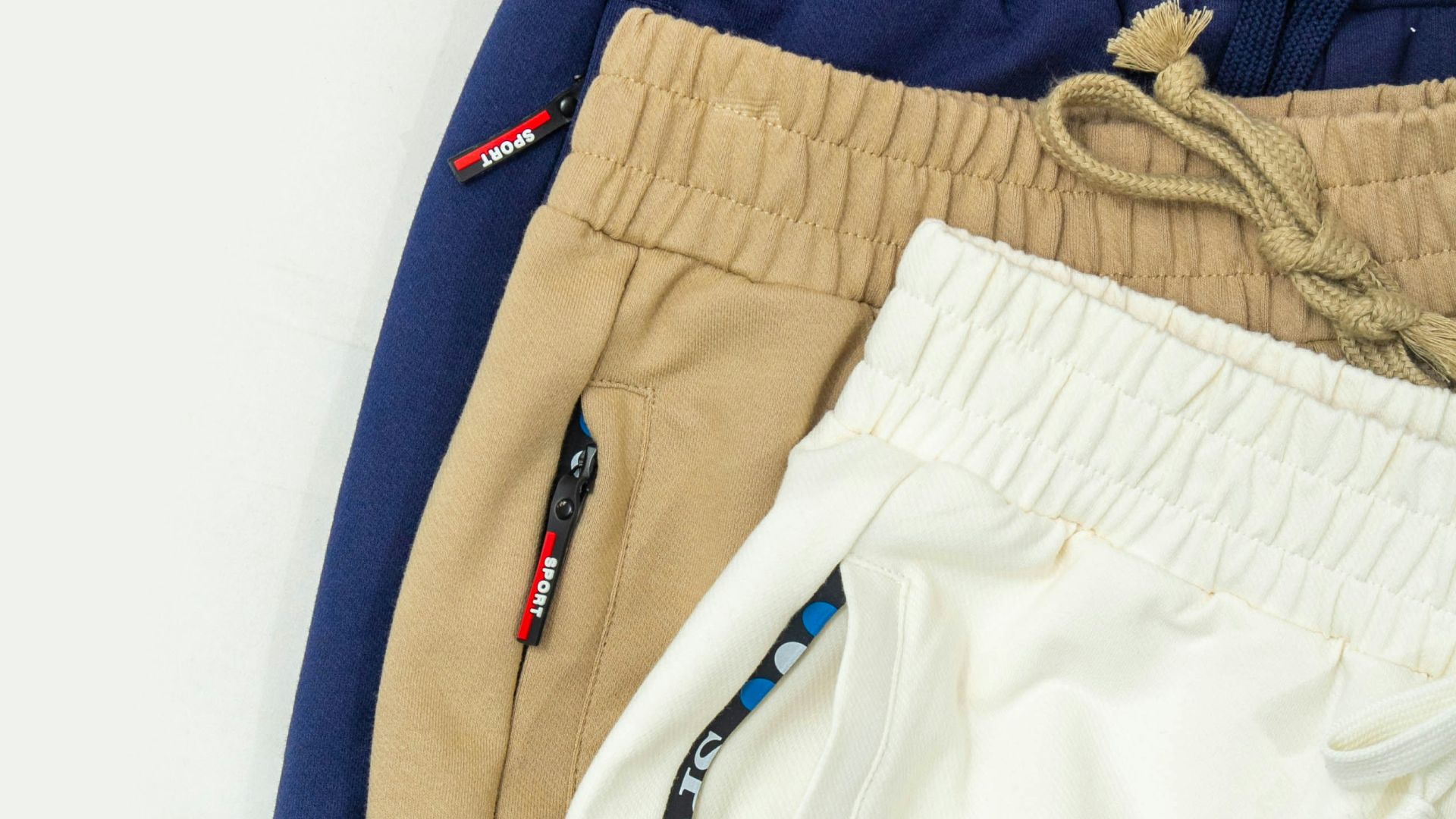 A group of three men's shorts sitting next to each other