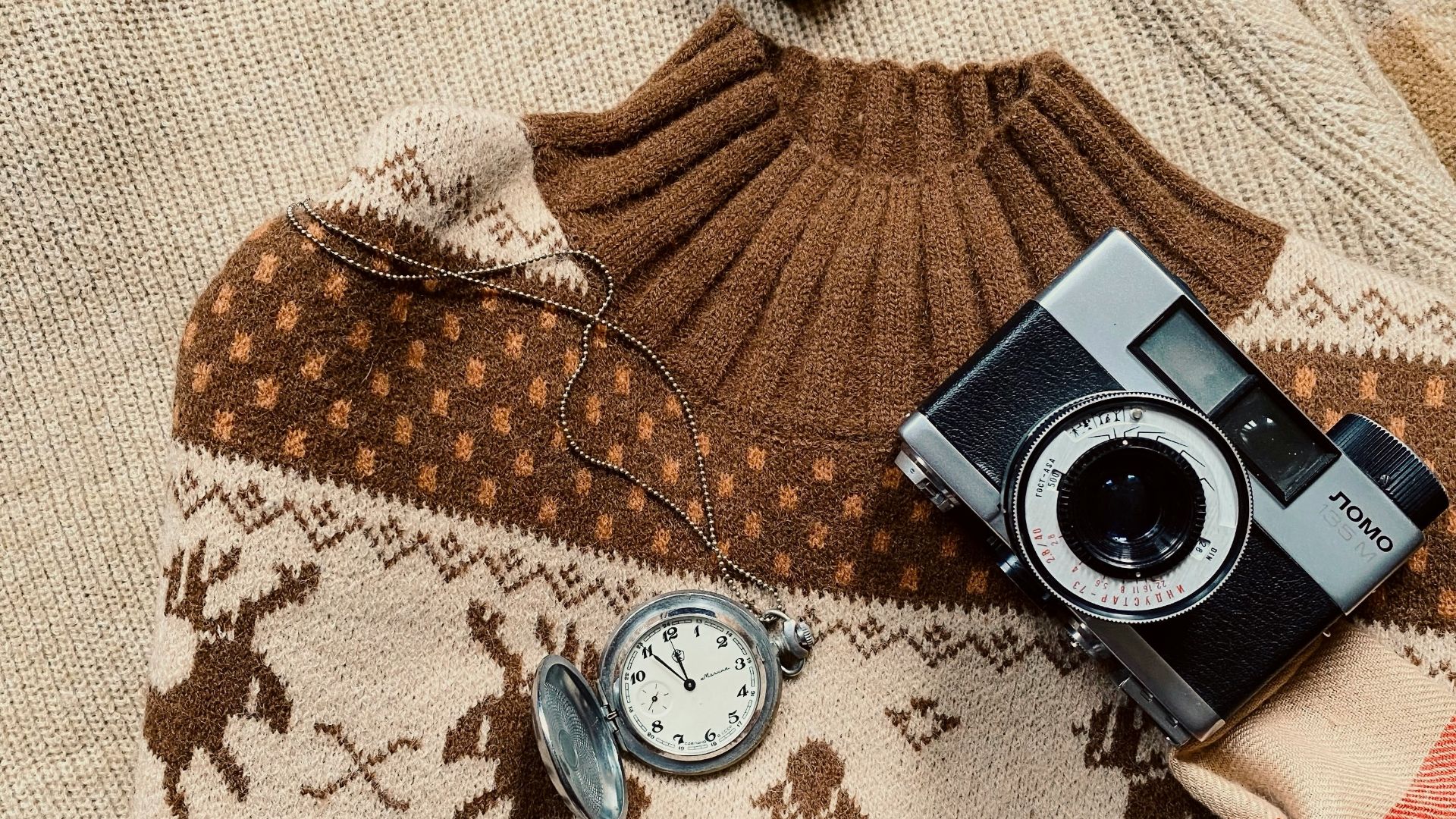 a couple of watches on a bed