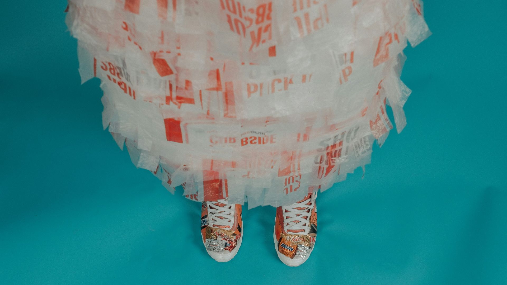 person wearing brown-and-white lace-up shoes