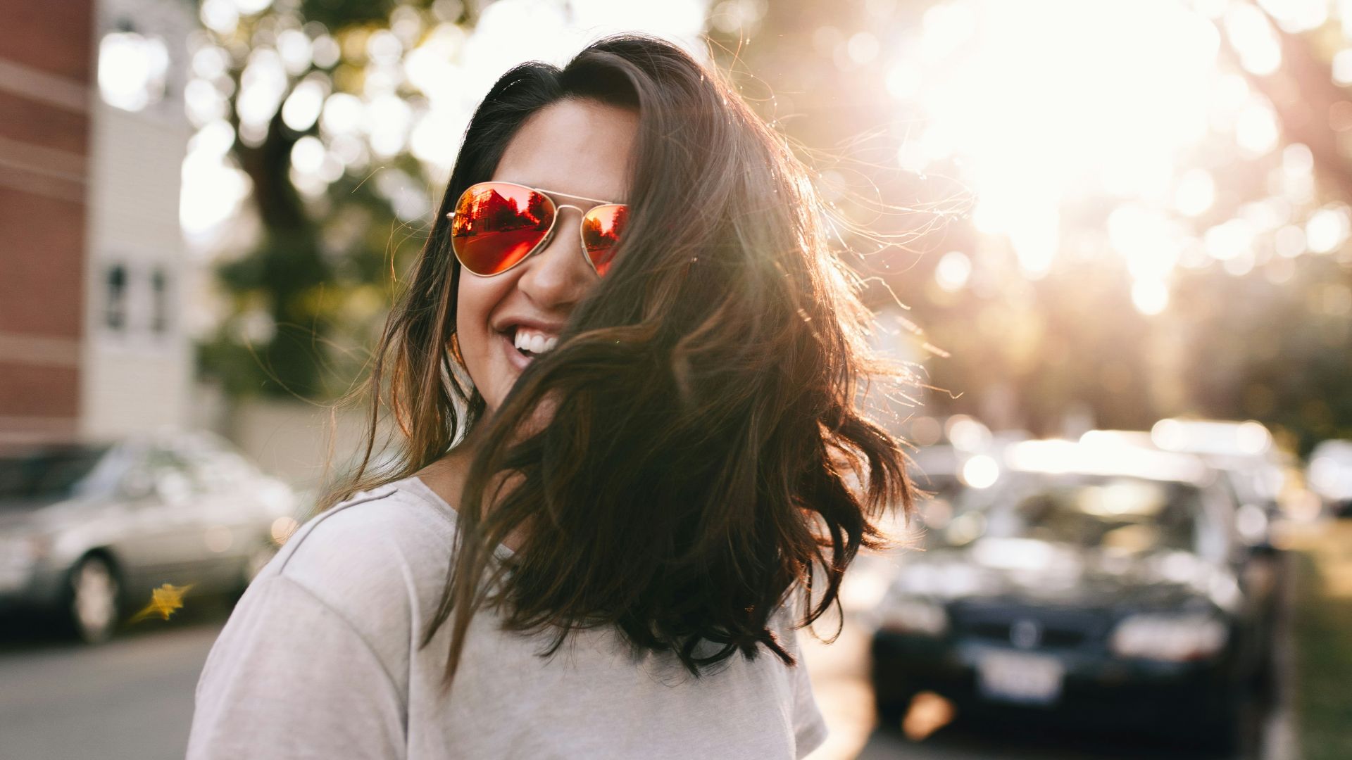 woman wearing white T-shirt smiling