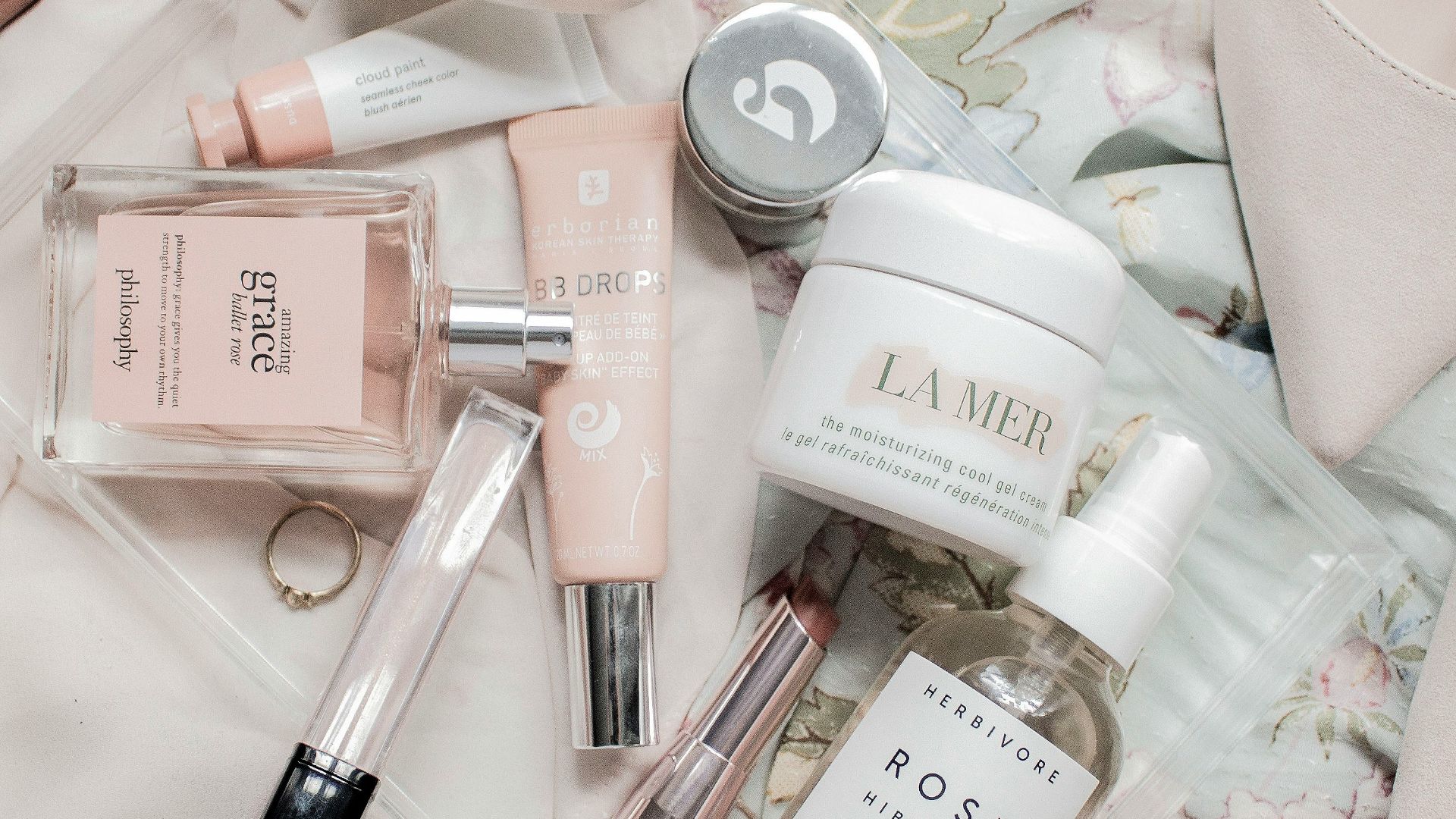 white ceramic mug on white textile