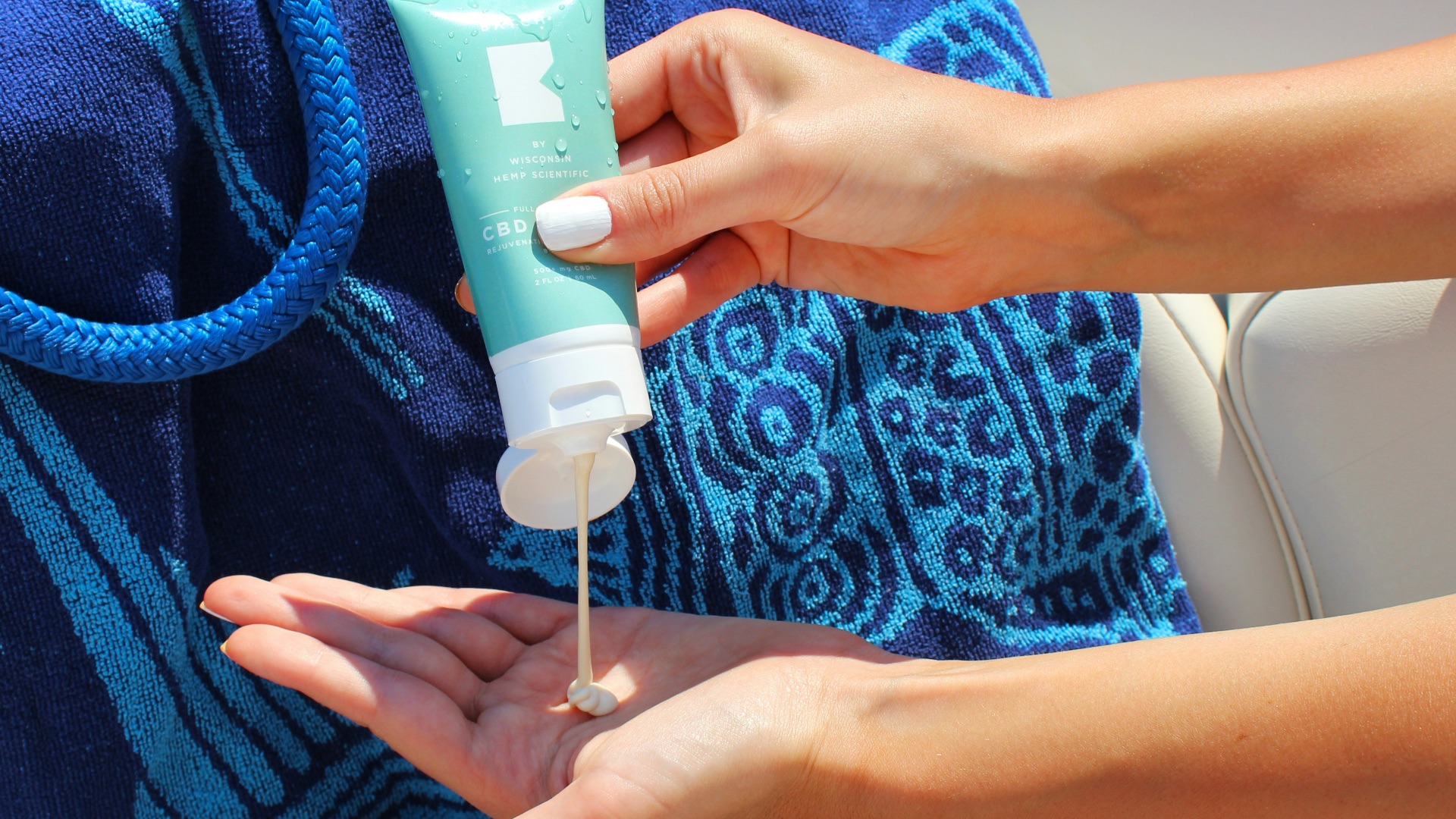 person holding white plastic tube bottle