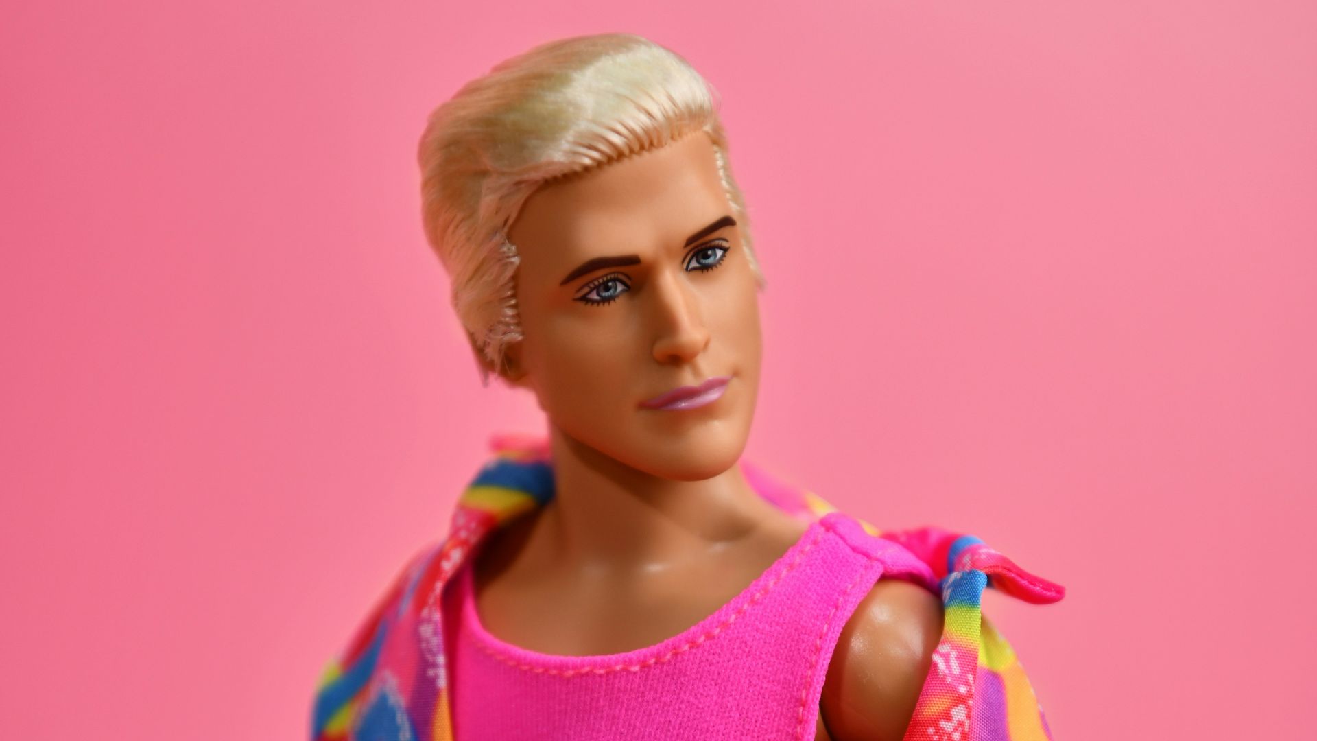 Blonde doll wearing colorful 80s style outfit