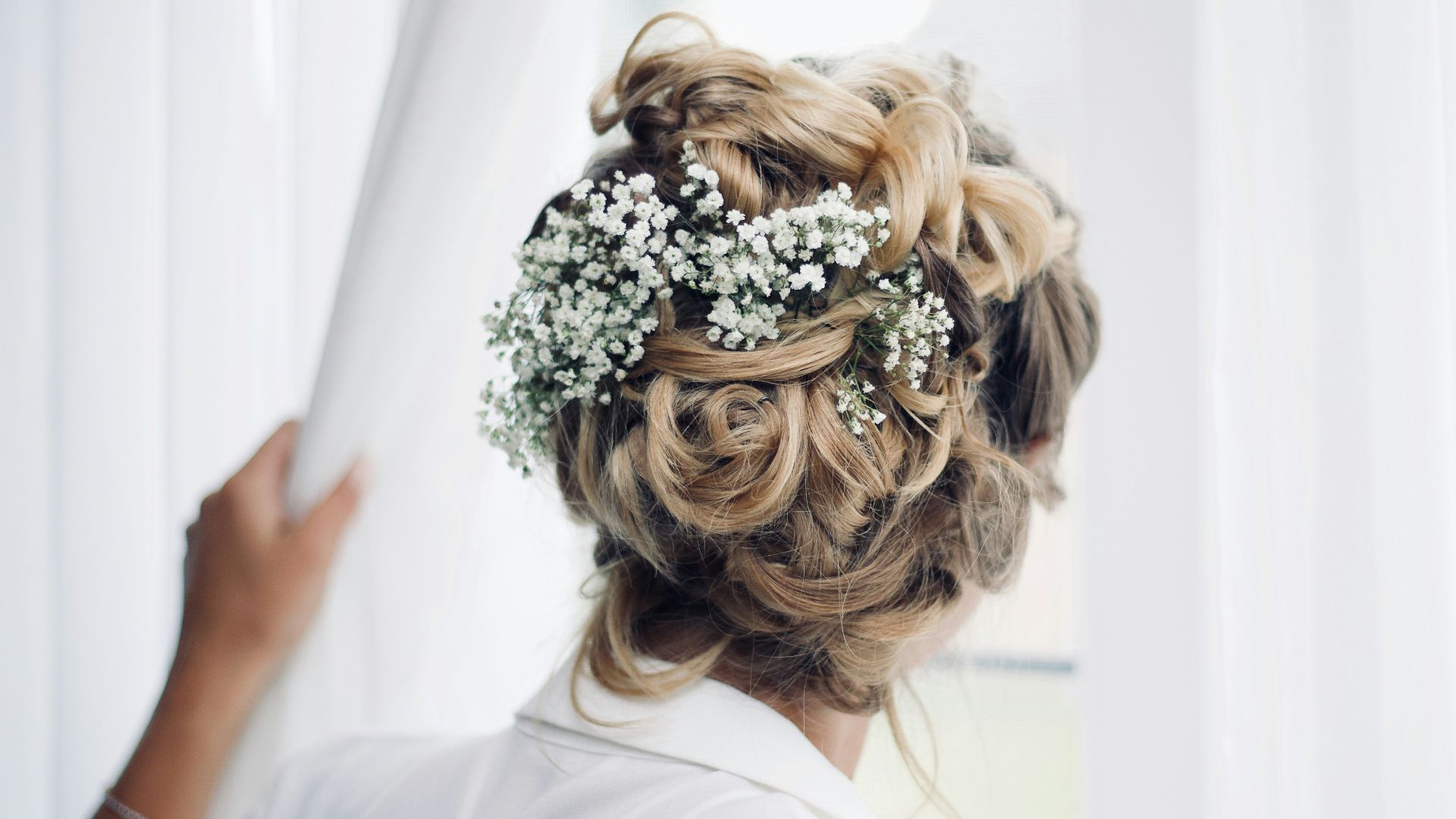 woman standing near window