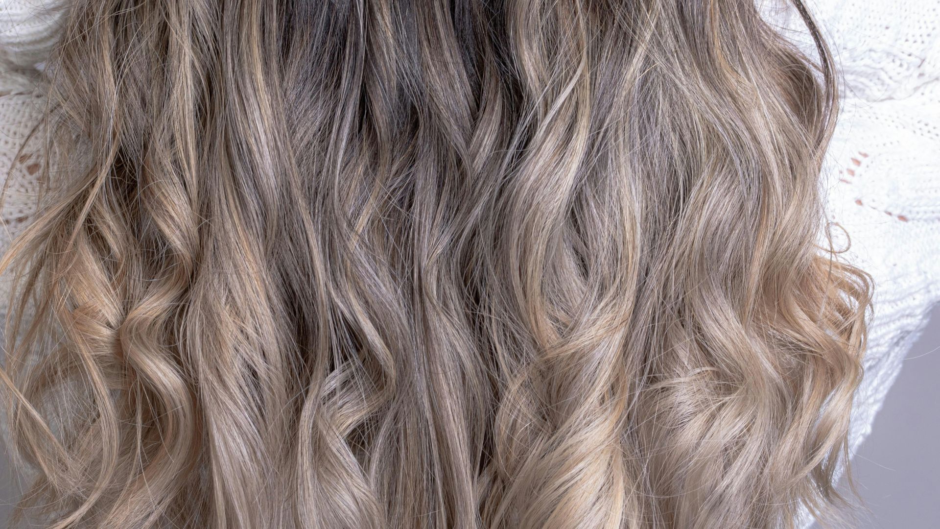 woman in white shirt with blonde hair