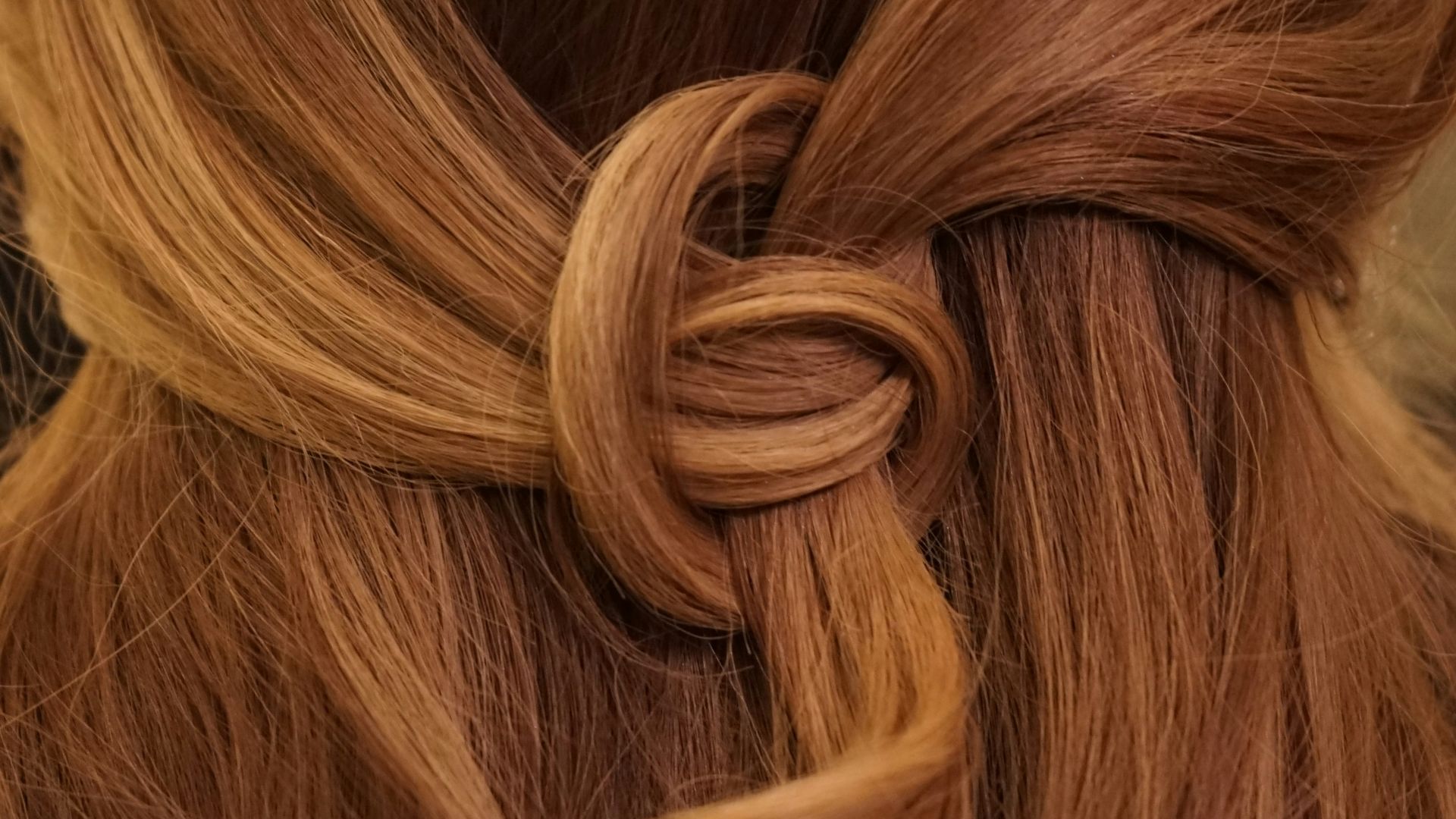 brown hair on white textile