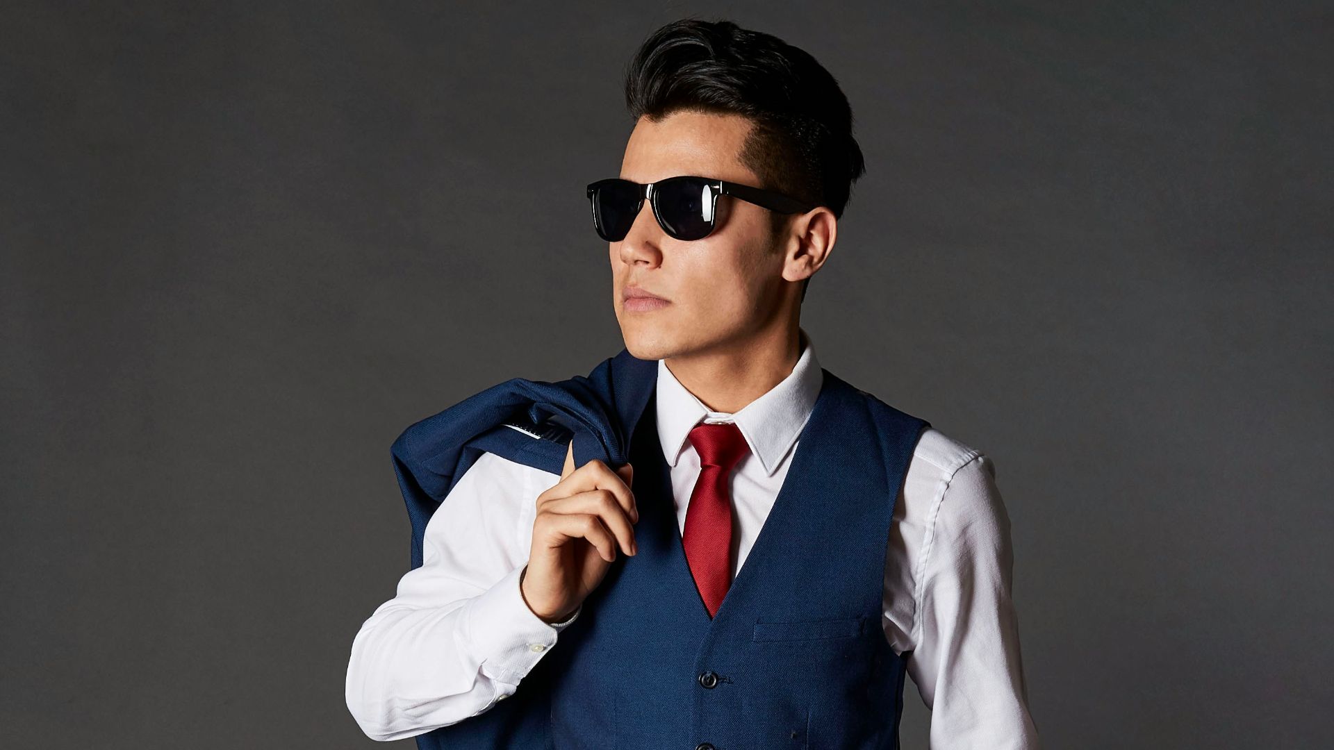 standing man with suit and sunglasses