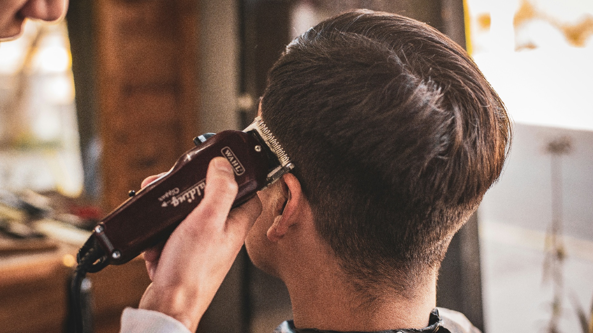man in white dress shirt holding black dslr camera