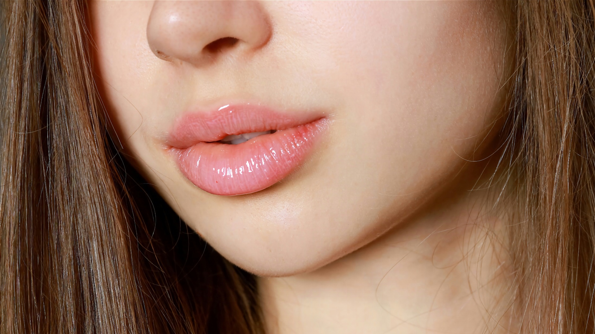 a close up of a woman with long brown hair