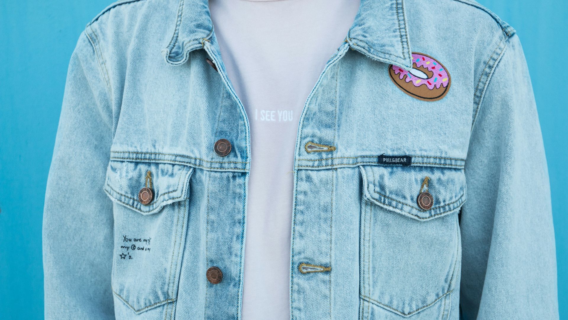 close shot of person denim top